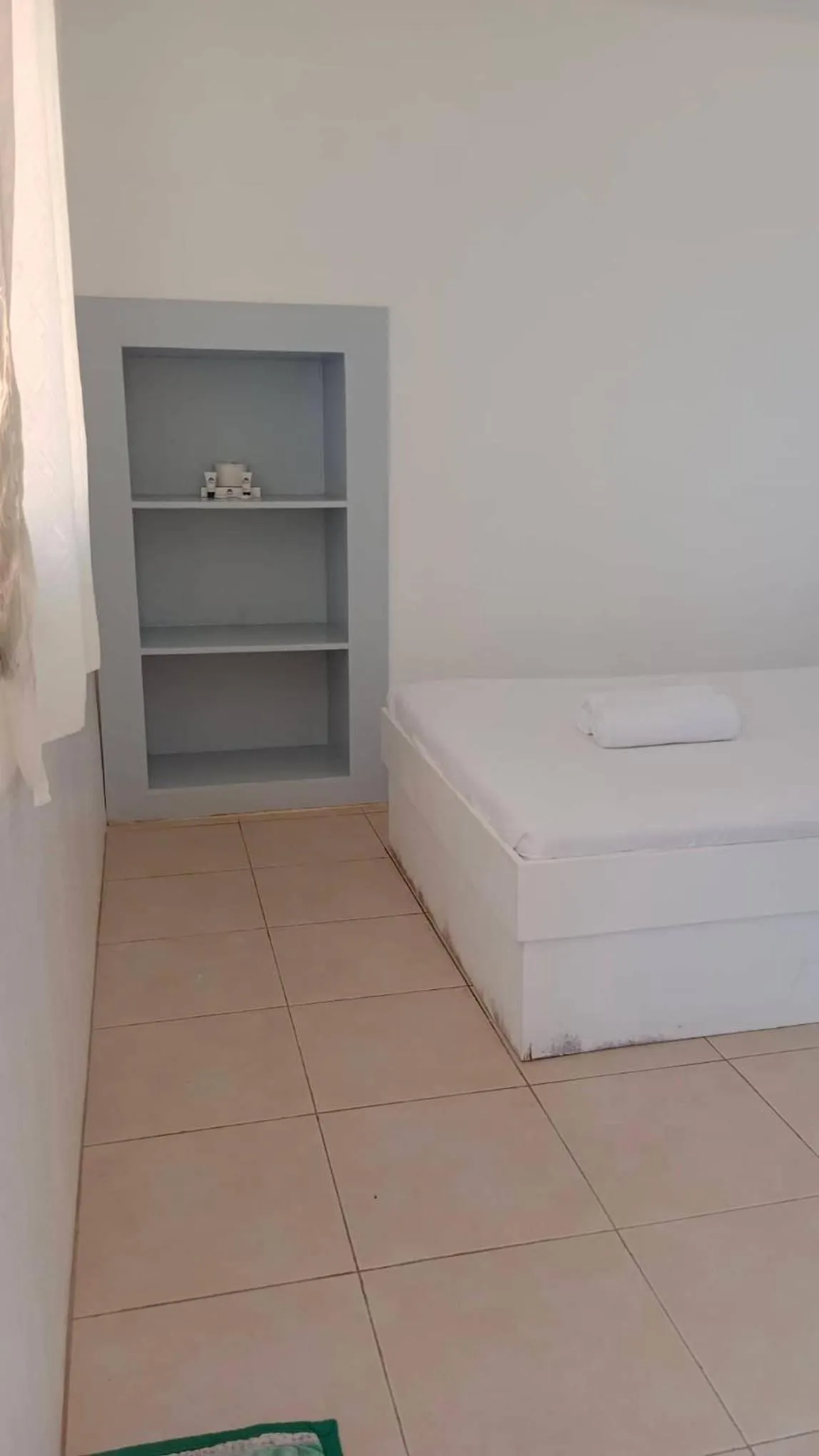 Bed in The Waterfront Beach Resort