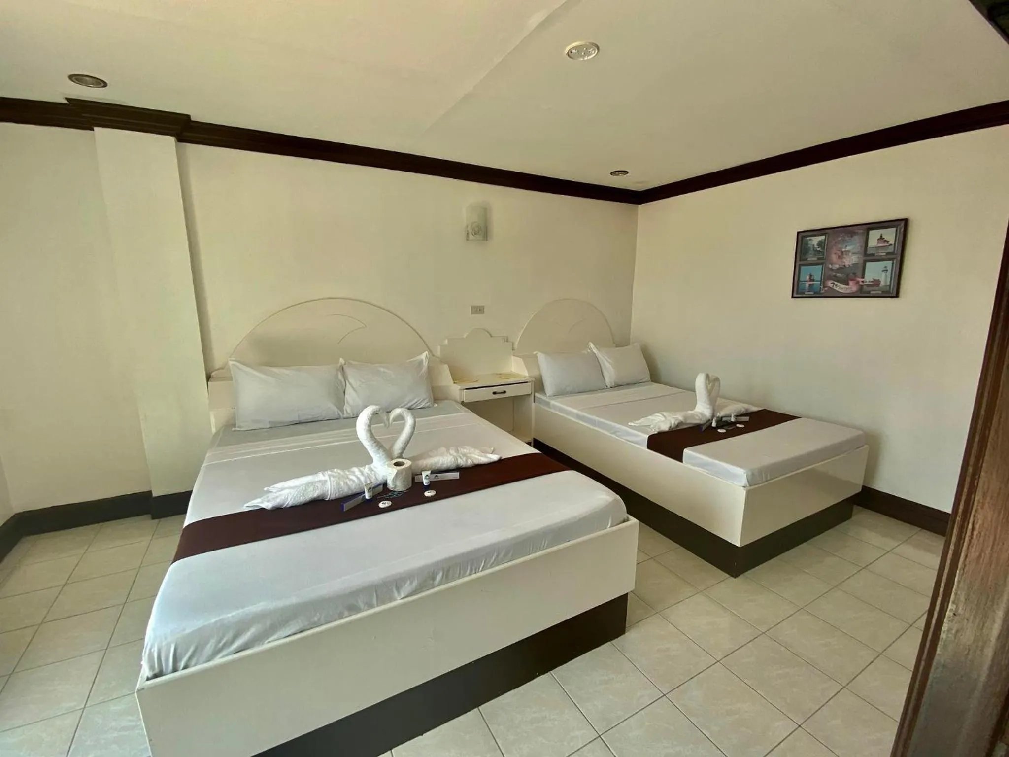 Bed in The Waterfront Beach Resort