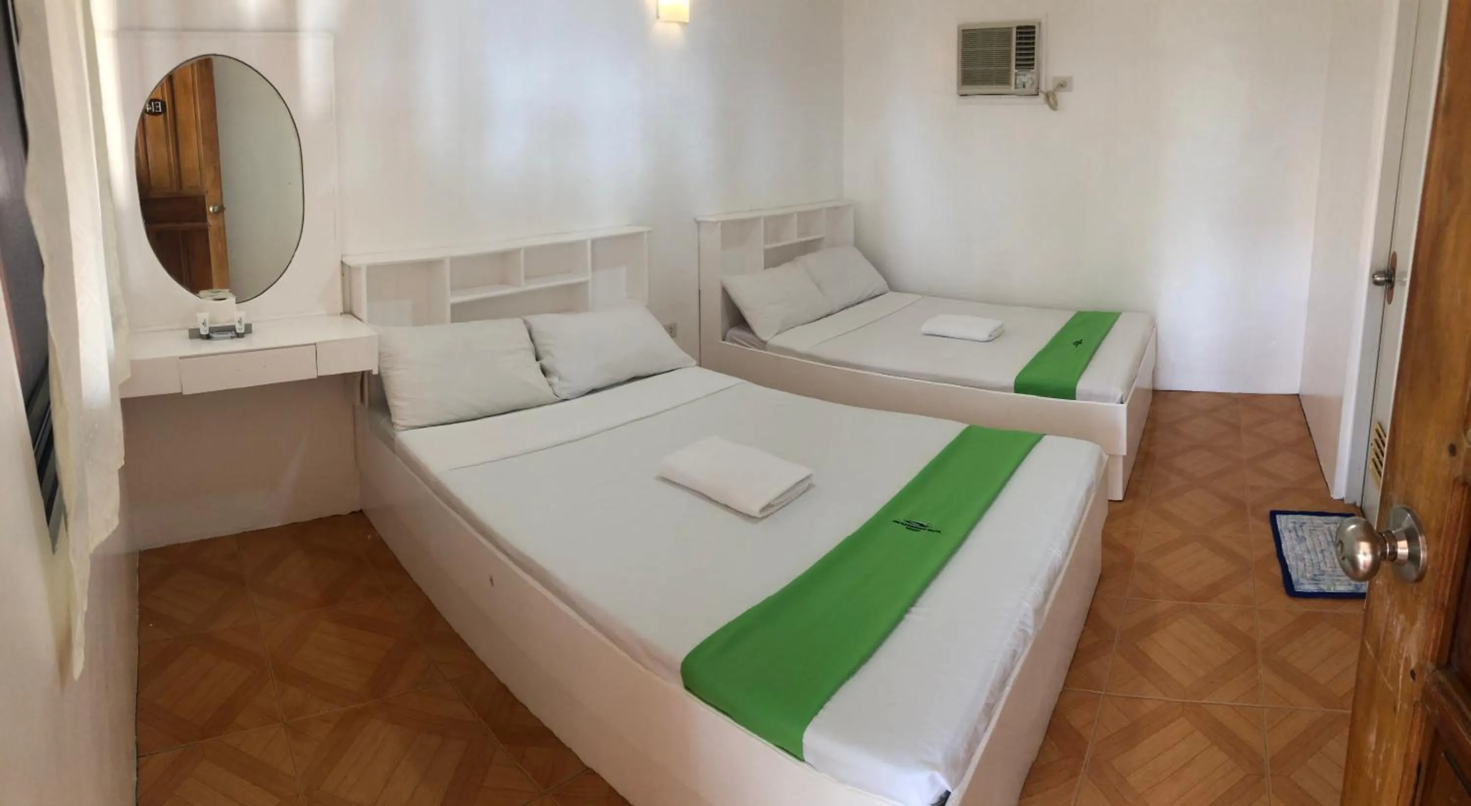 Bed in The Waterfront Beach Resort