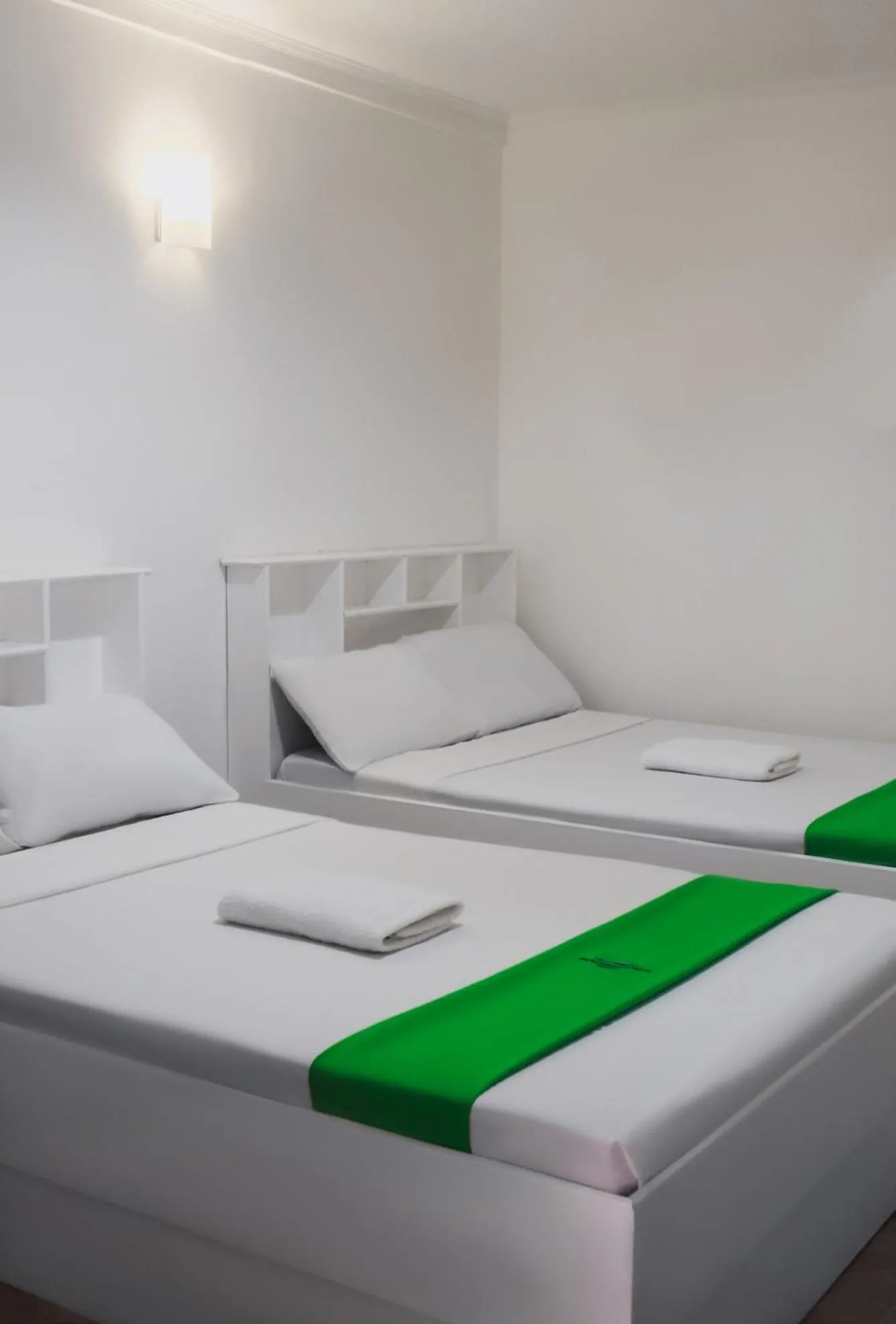 Bed in The Waterfront Beach Resort