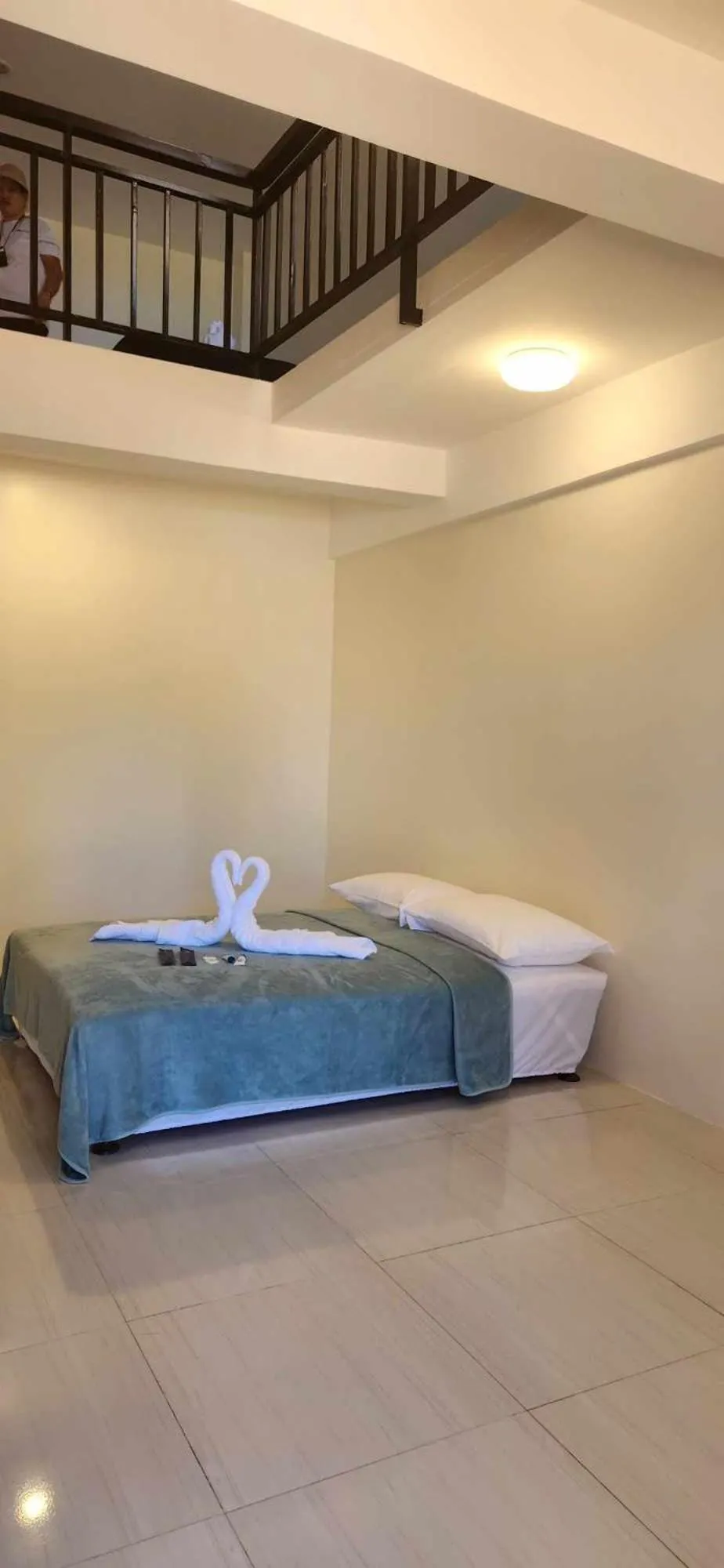 Bed in The Waterfront Beach Resort