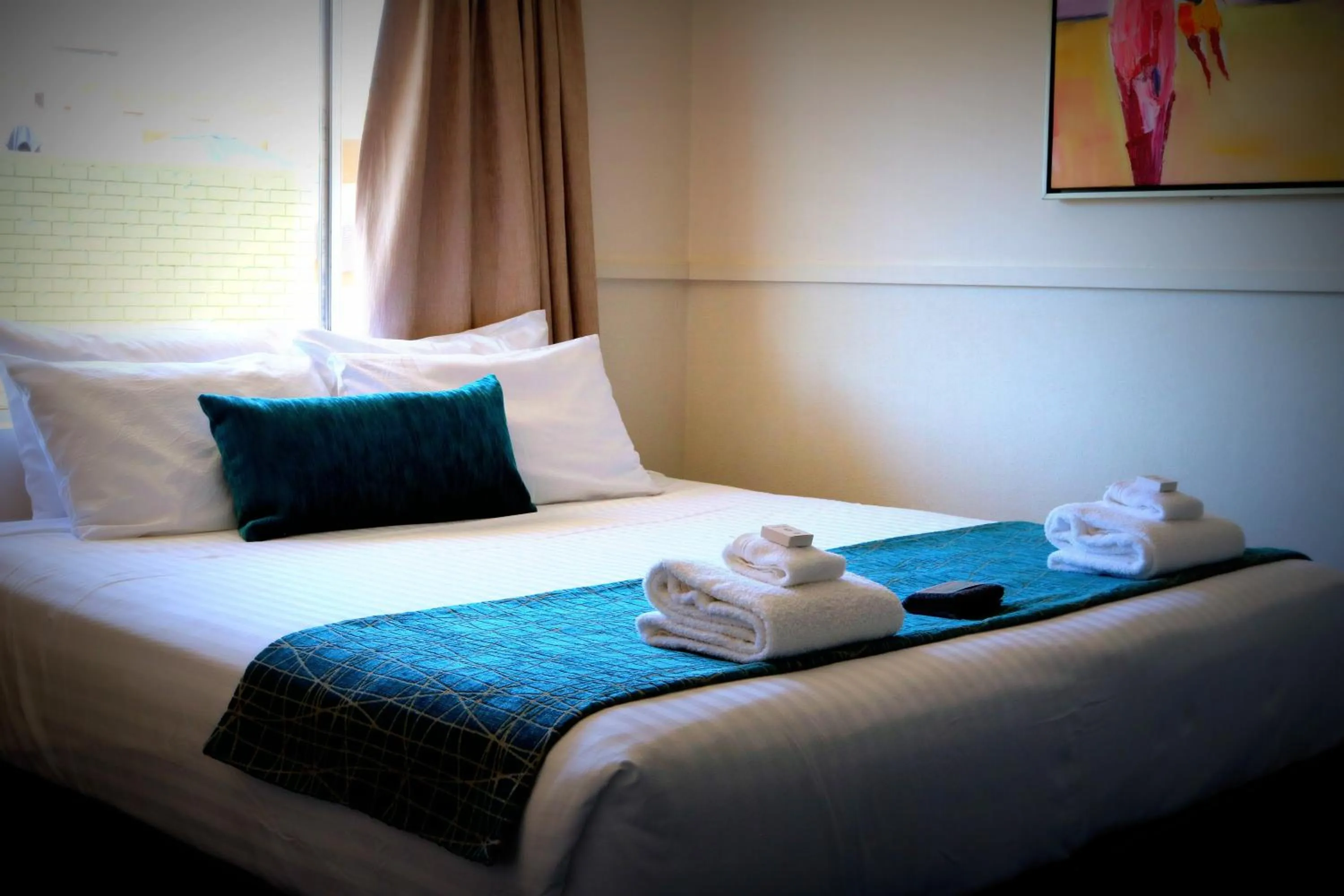 Bed in The Commercial Hotel Motel