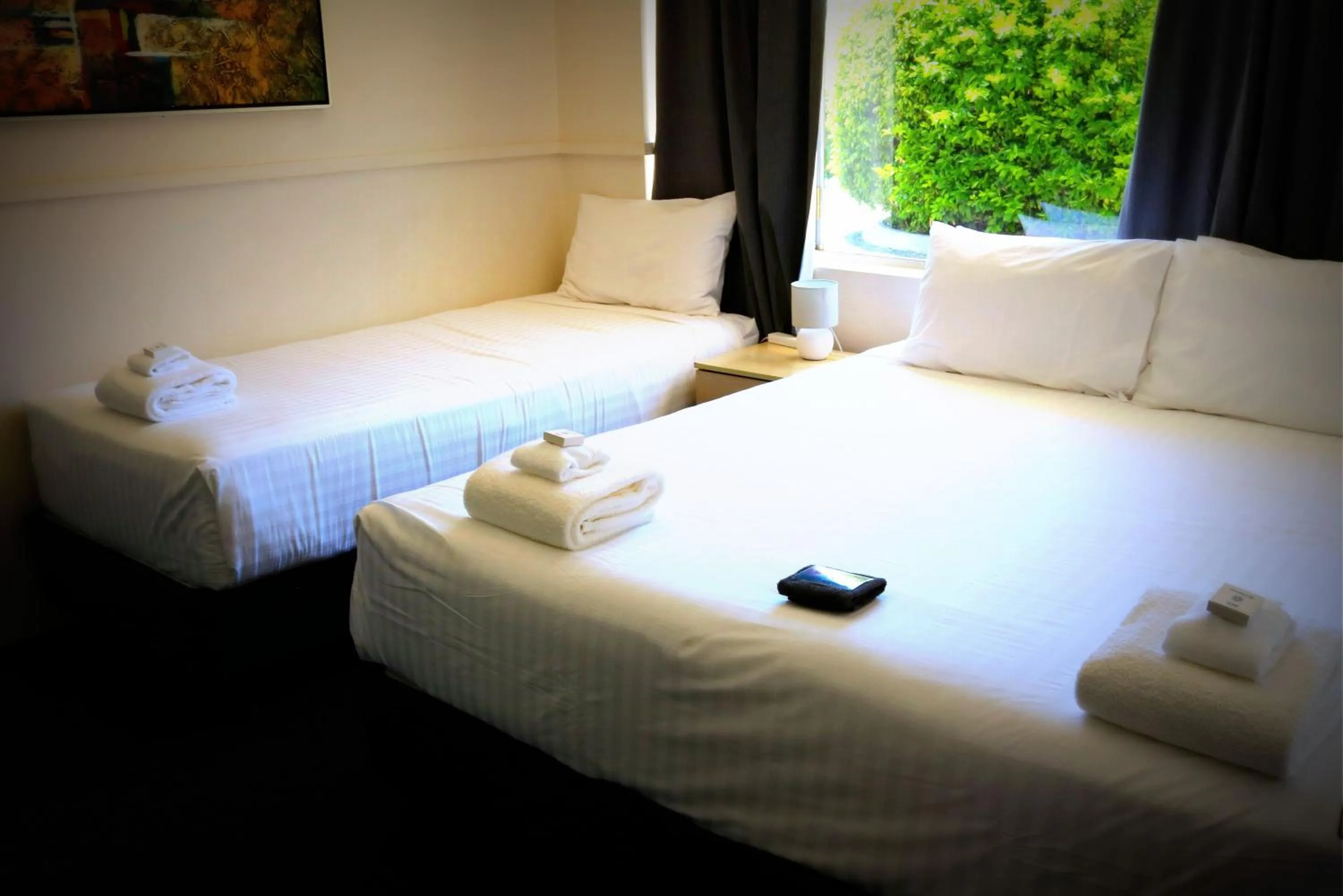 Bed in The Commercial Hotel Motel