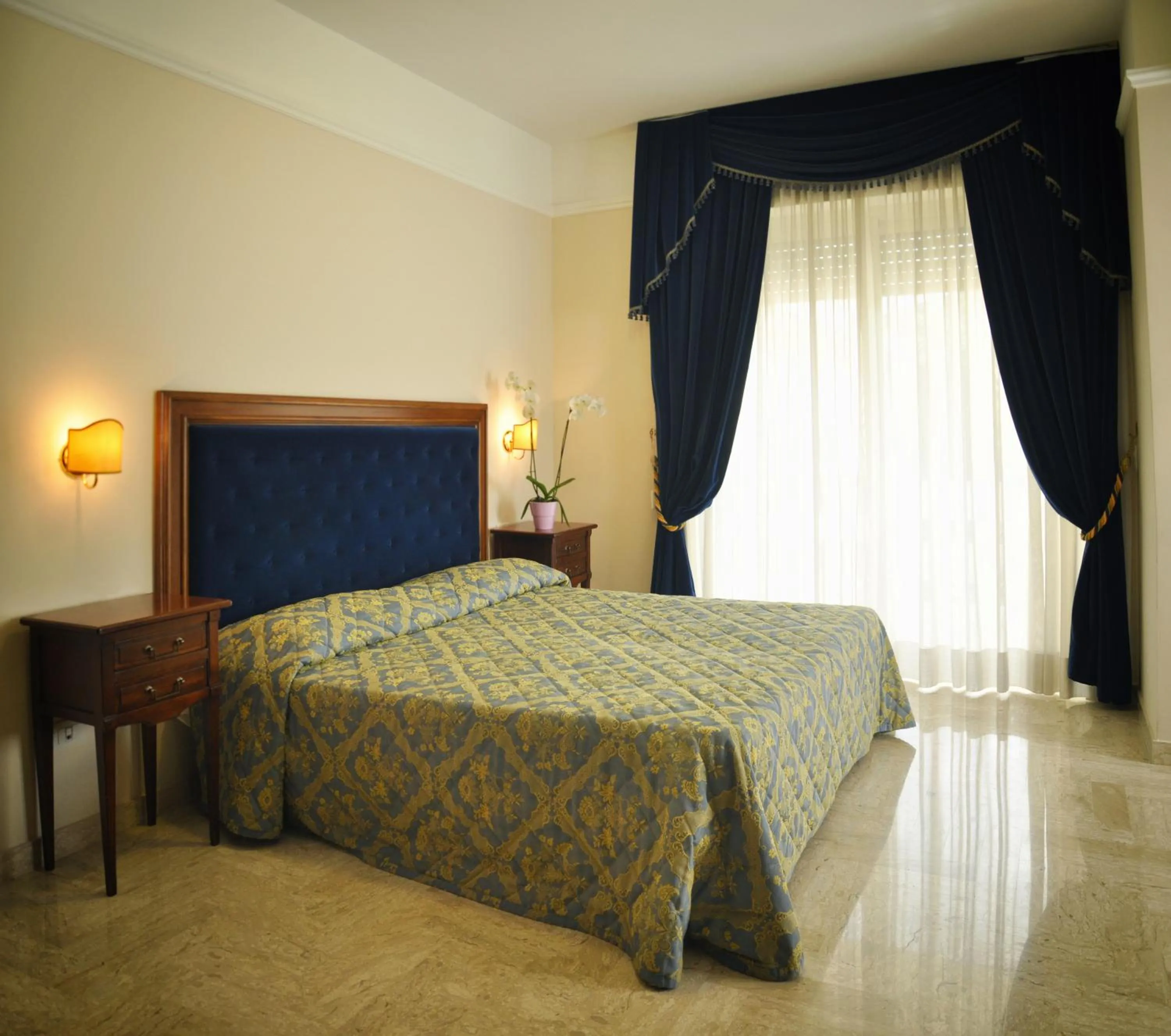 Bedroom in Mondial Park Hotel