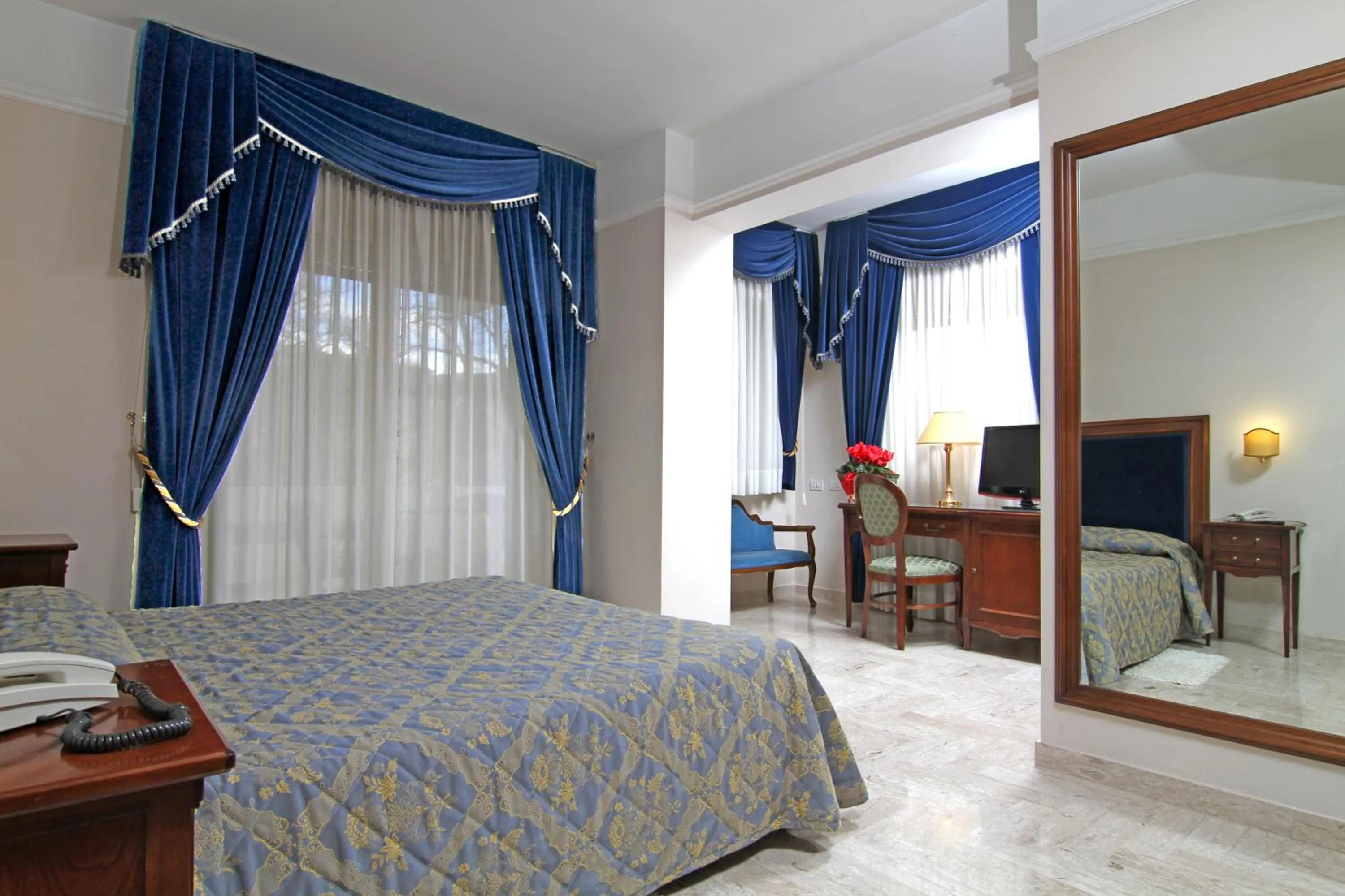 Bedroom in Mondial Park Hotel