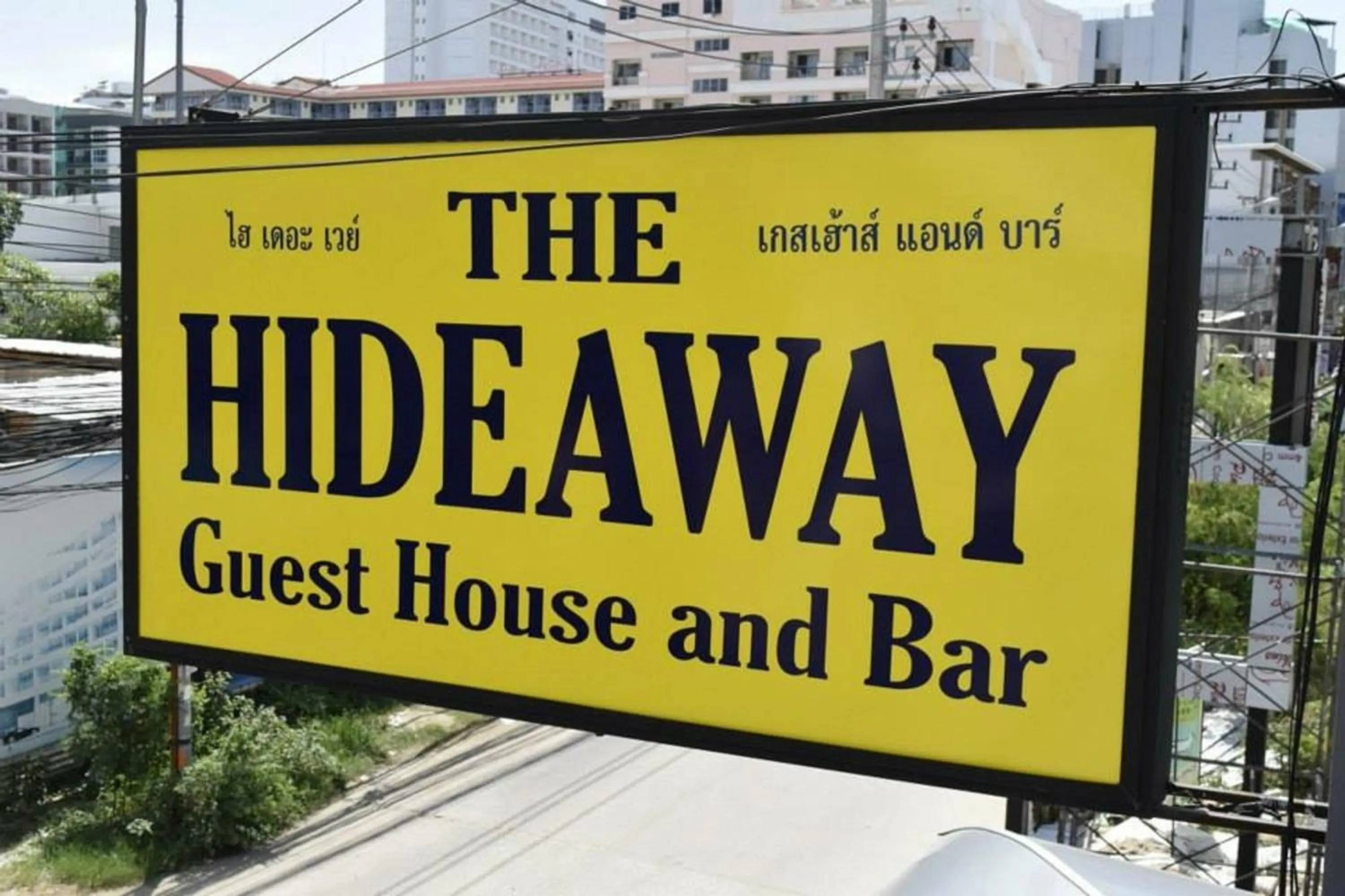 Property logo or sign in Hideaway Guest House And Bar