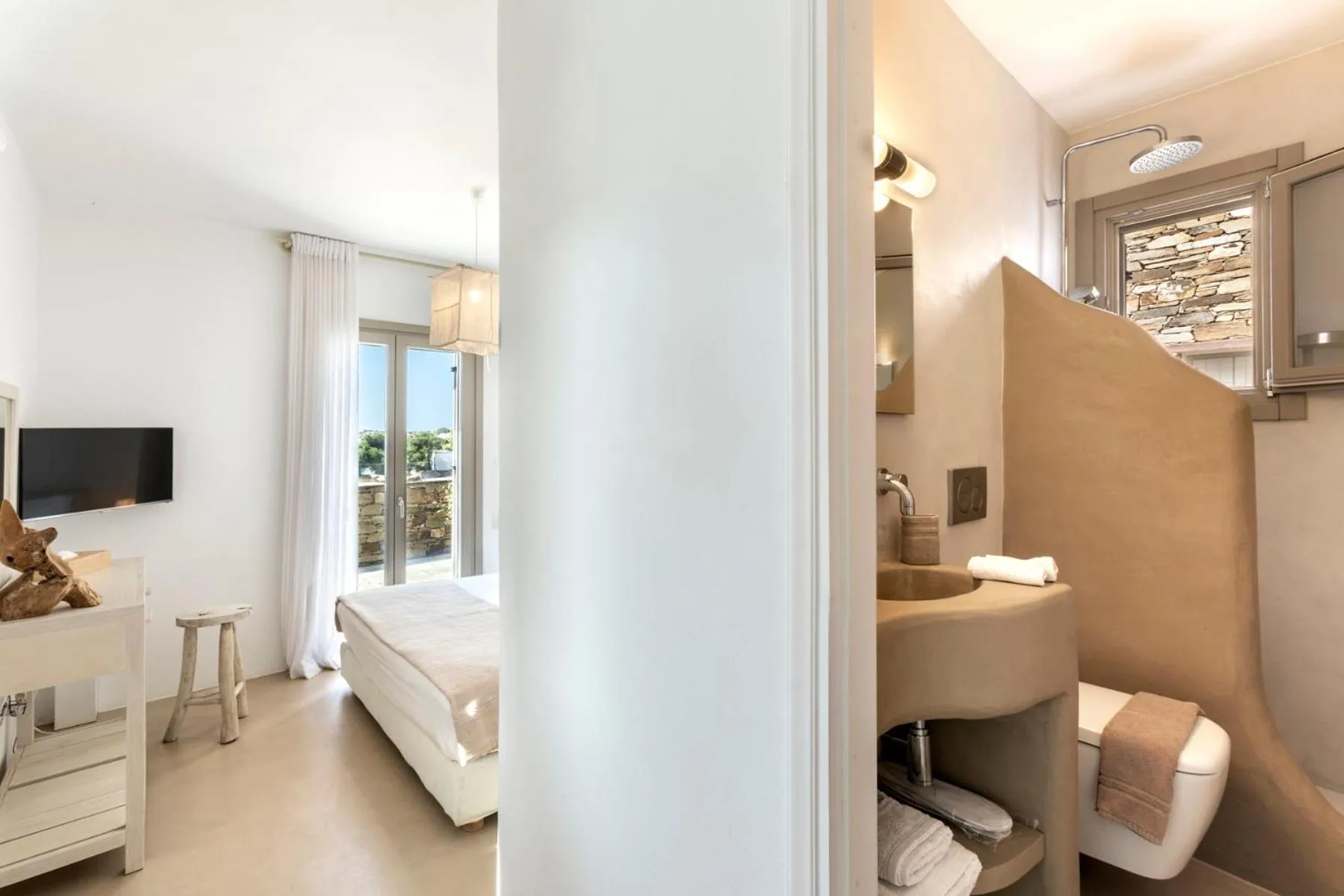 Bed in White Tinos Luxury Suites