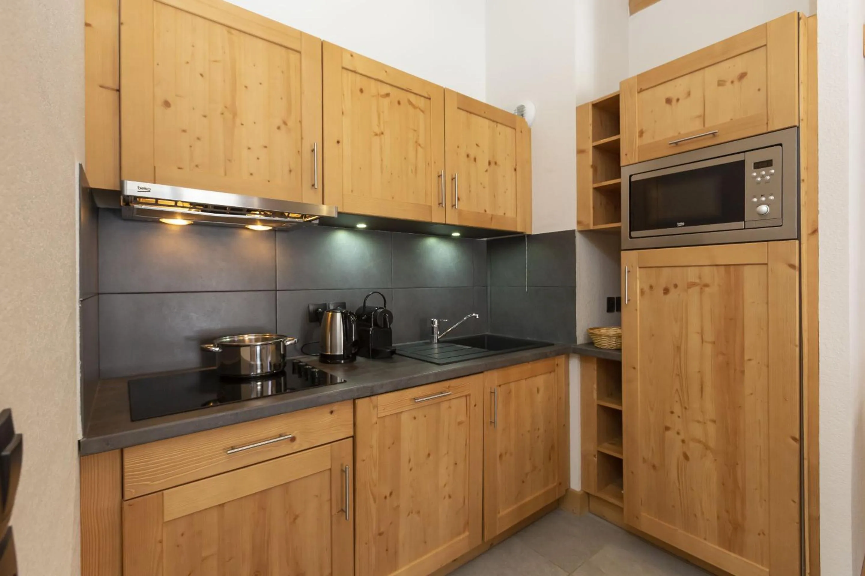 Kitchen or kitchenette in Résidence Odalys Les Fermes de Châtel