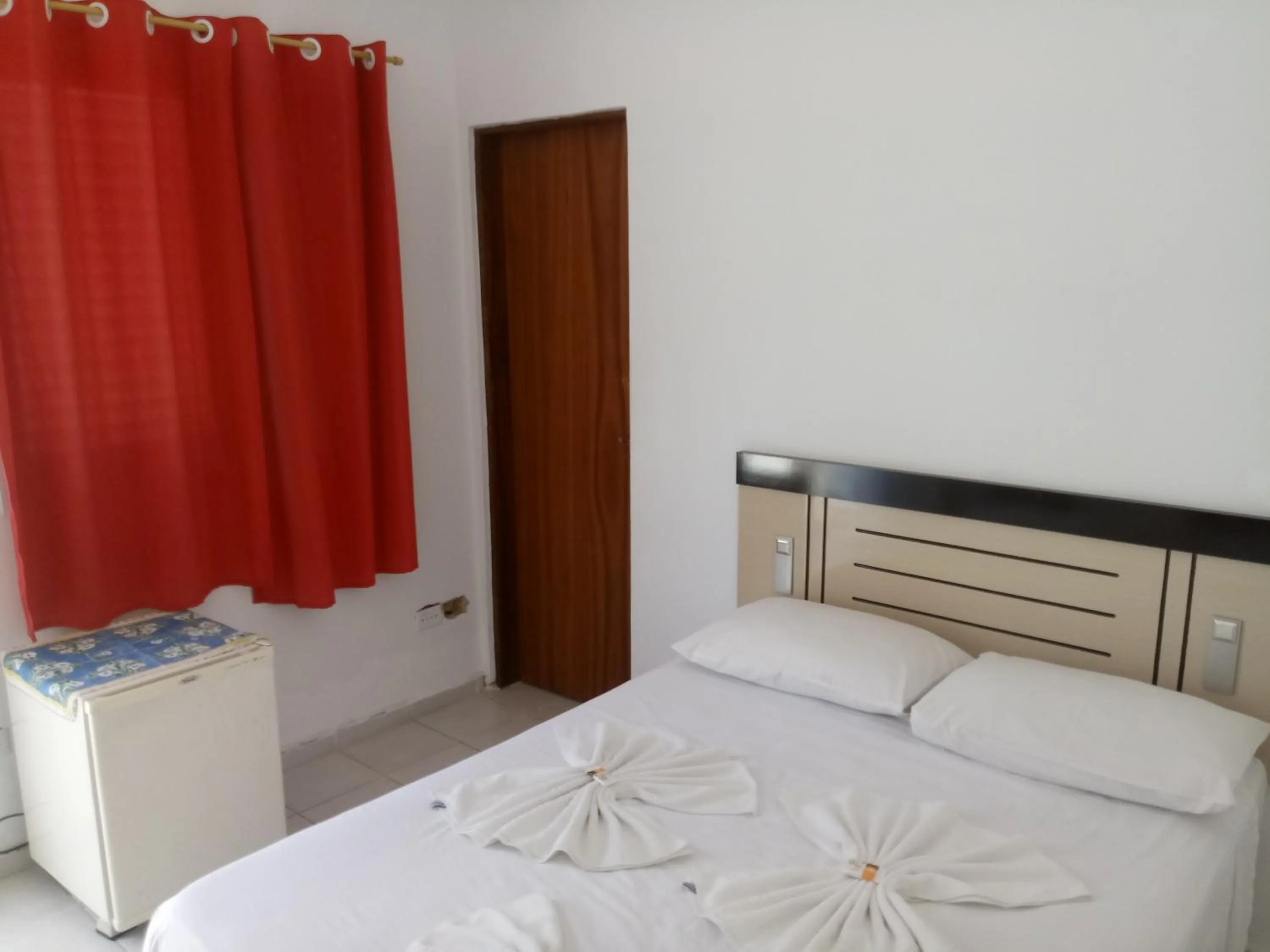 Bed in La Riviera Pousada Pantanal