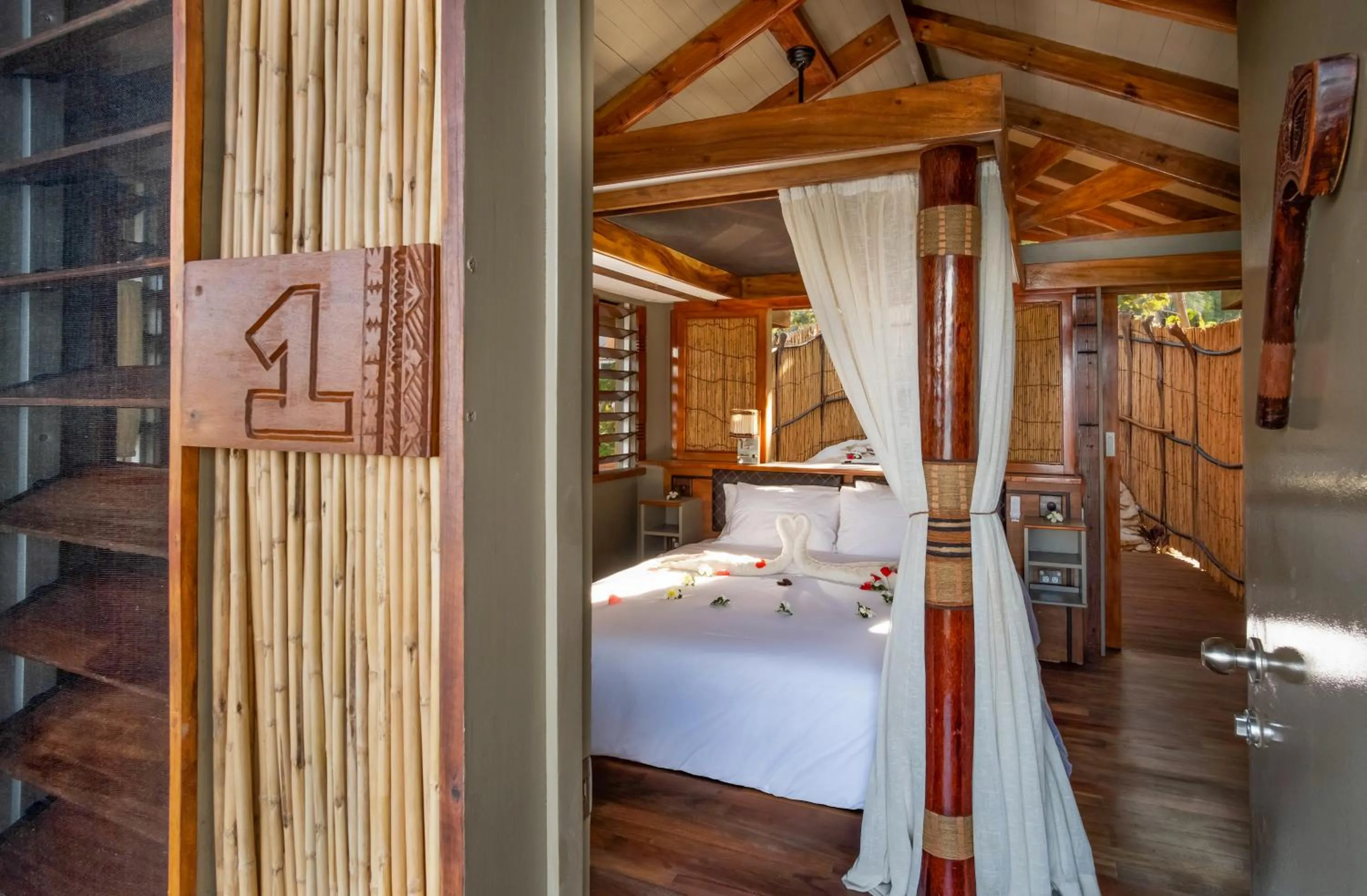 Bed in Barefoot Kuata Island Resort