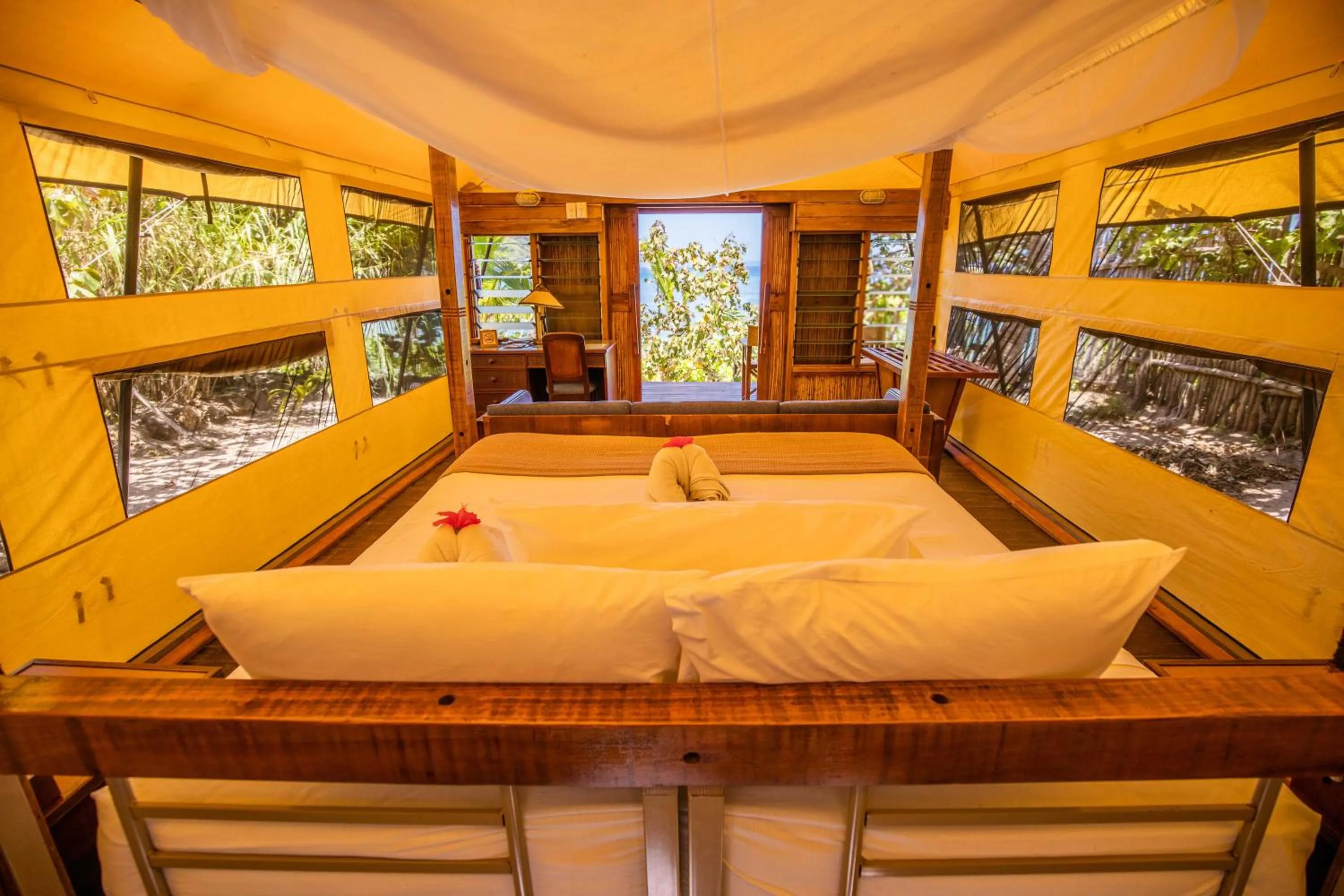 Bed in Barefoot Kuata Island Resort