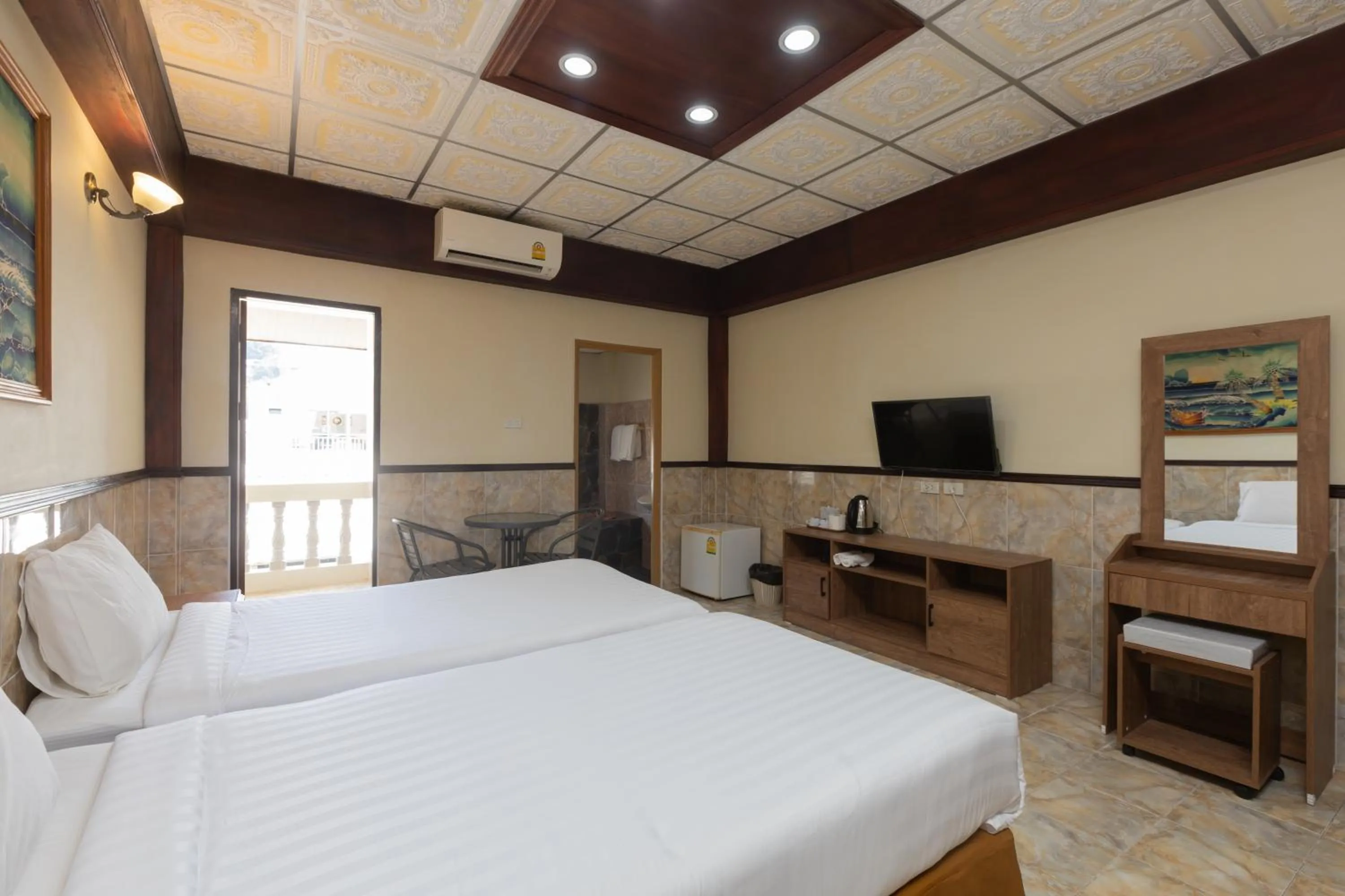 Bed in Kata Palace Phuket Hotel