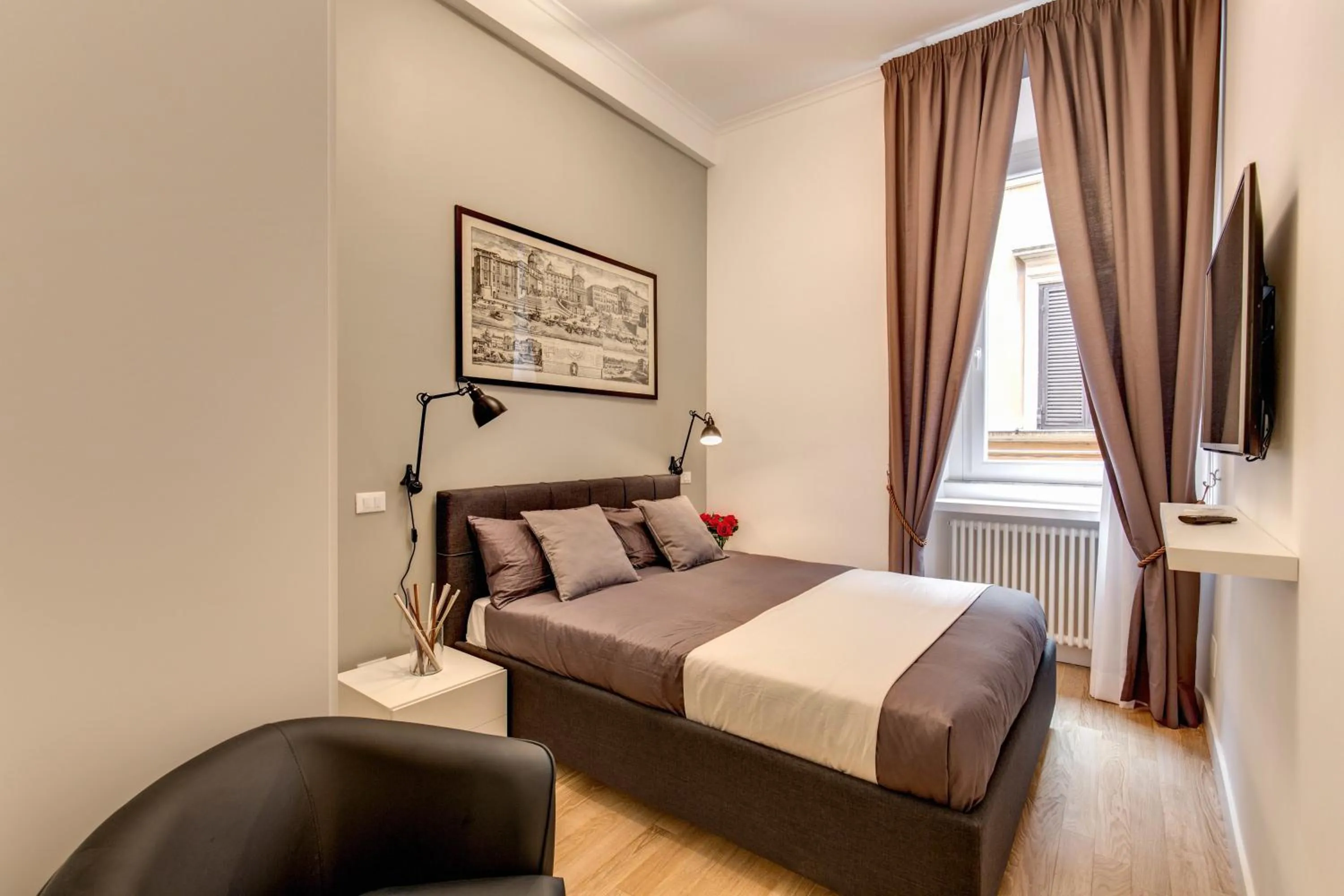 Photo of the whole room, Bed in Orange Suites