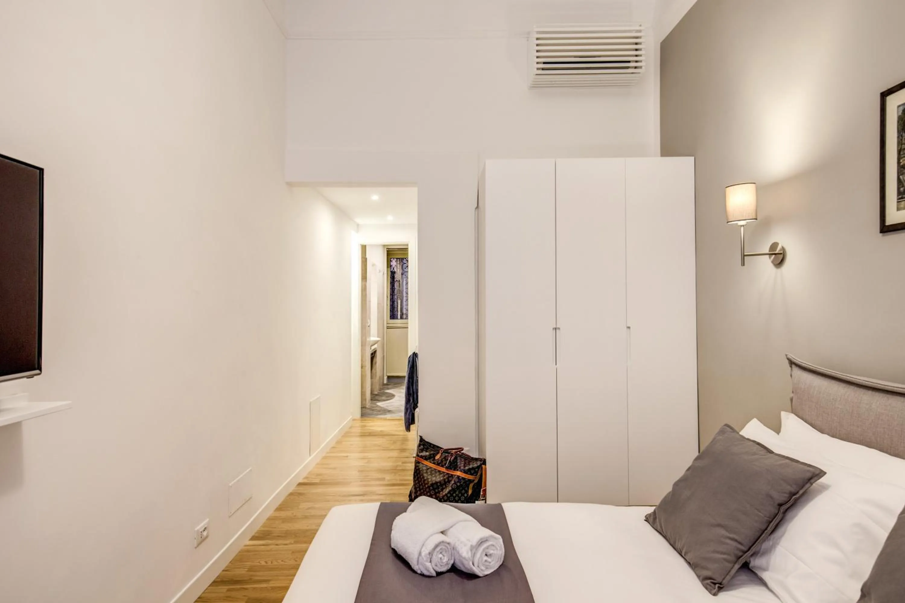 Photo of the whole room, Bed in Orange Suites