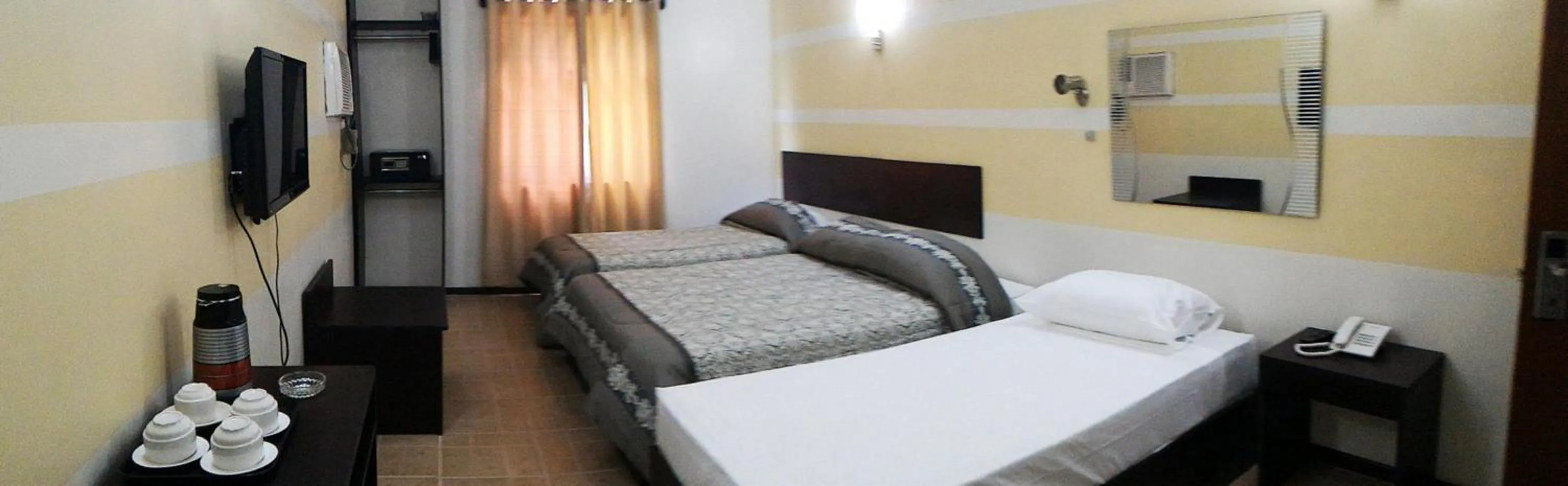 Photo of the whole room, Bed in Metro Park Hotel Mandaue