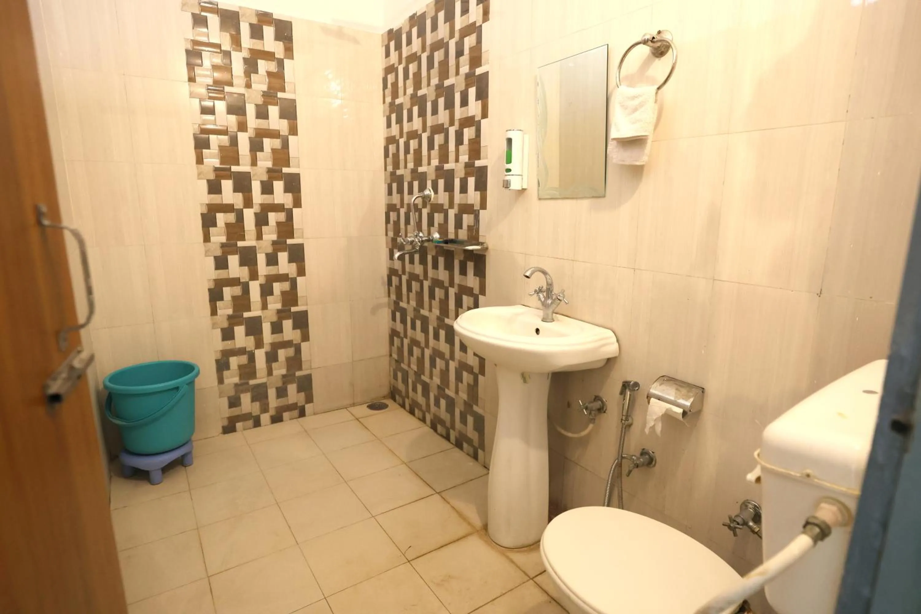Bathroom in Aranya Resort & Suites By Shivaneel Hospitality