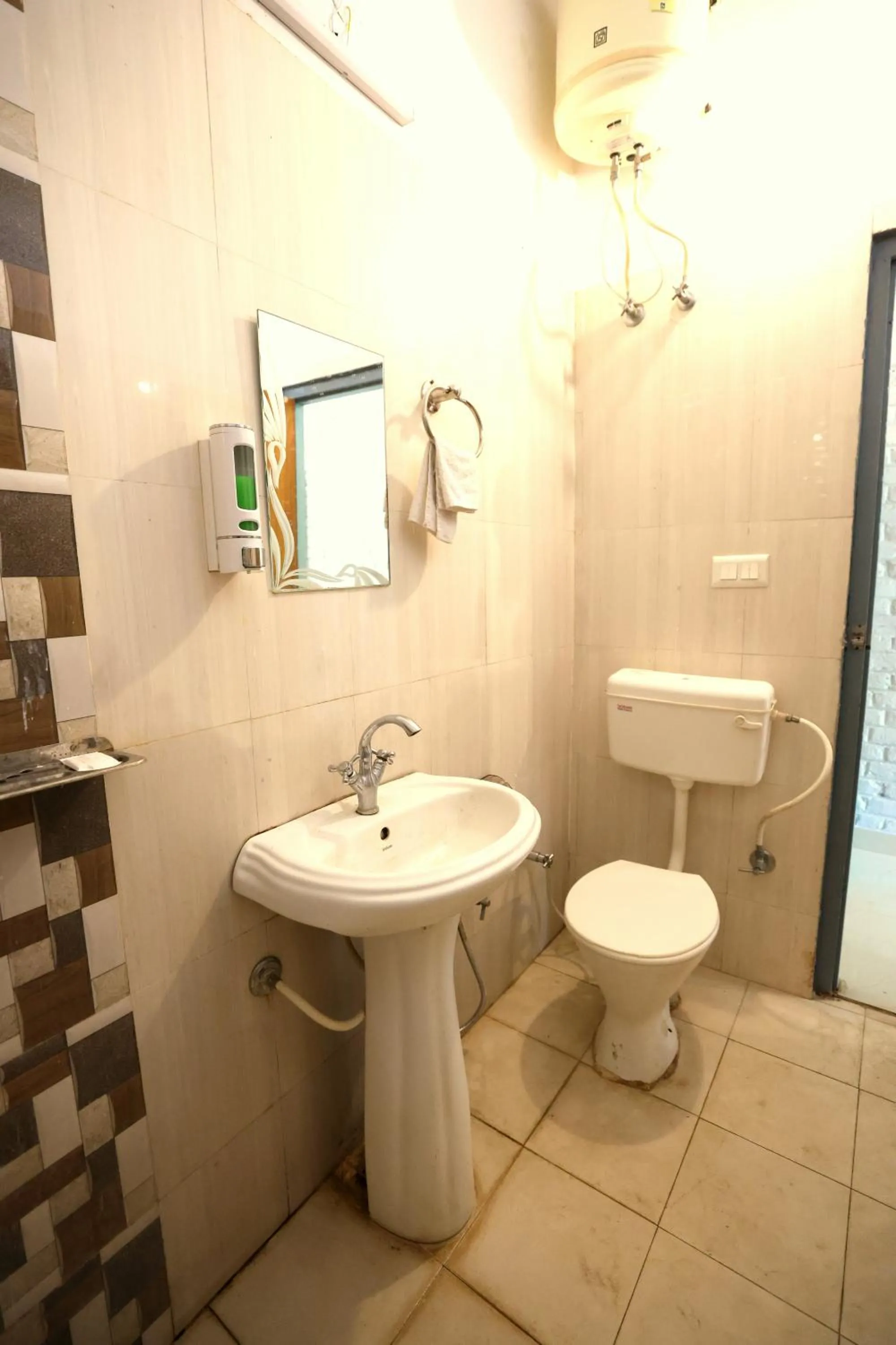 Bathroom in Aranya Resort & Suites By Shivaneel Hospitality