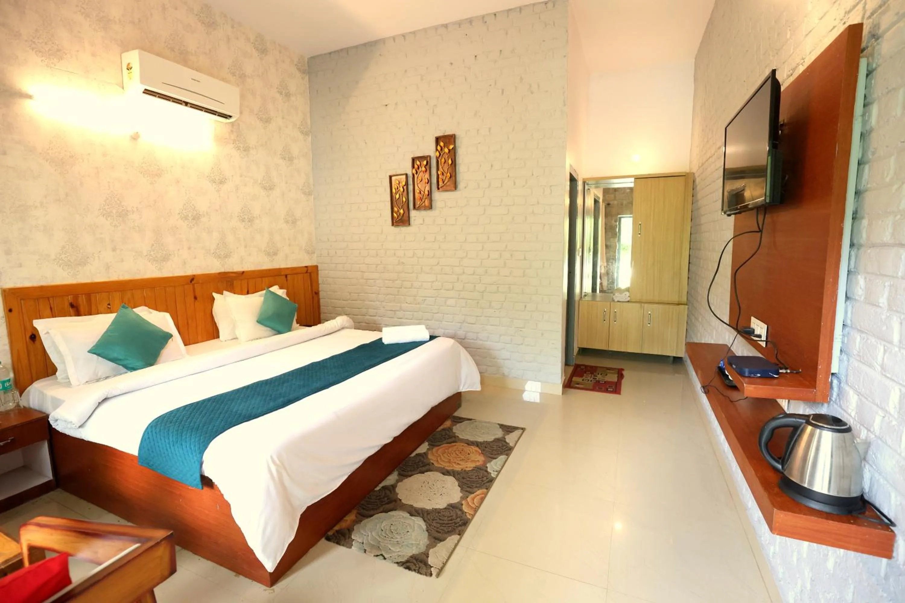 Photo of the whole room, Bed in Aranya Resort & Suites By Shivaneel Hospitality