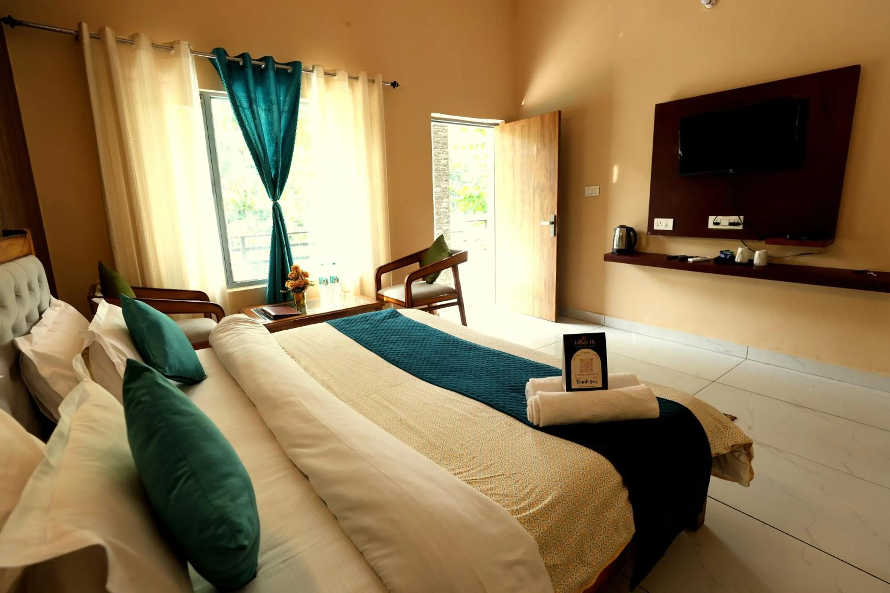 Photo of the whole room, Bed in Aranya Resort & Suites By Shivaneel Hospitality