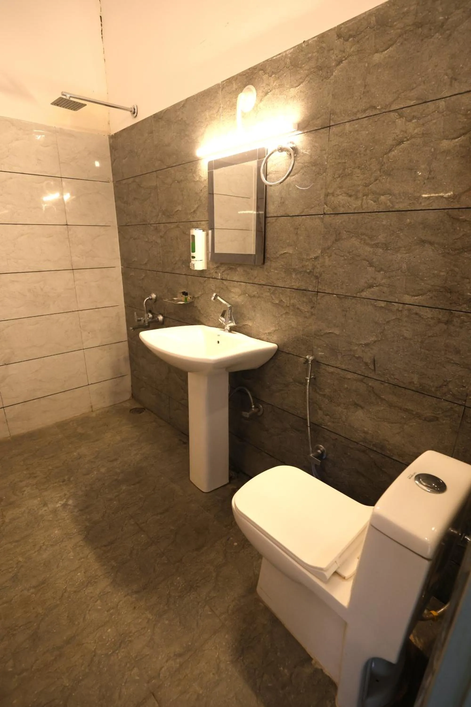Bathroom in Aranya Resort & Suites By Shivaneel Hospitality