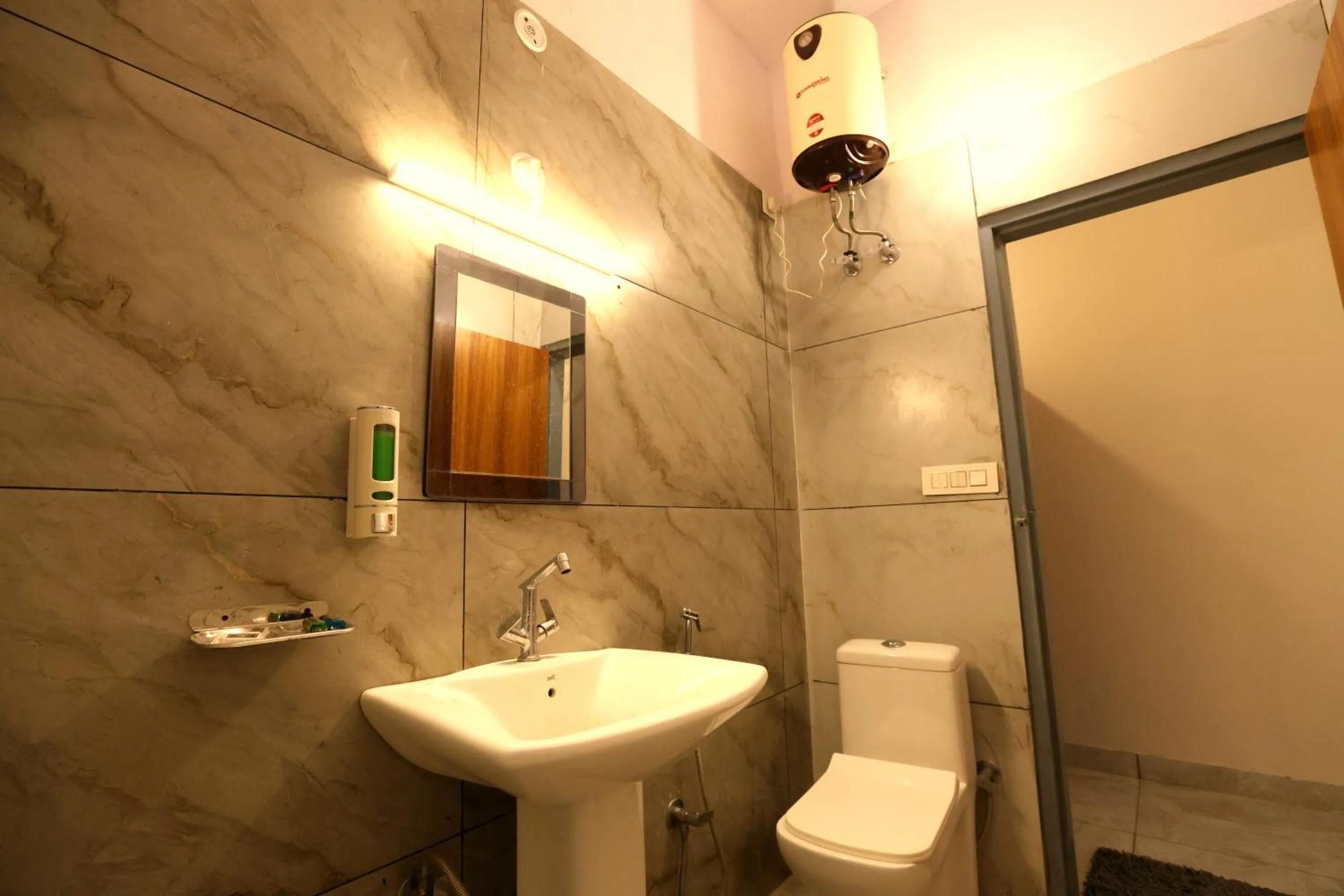 Toilet in Aranya Resort & Suites By Shivaneel Hospitality