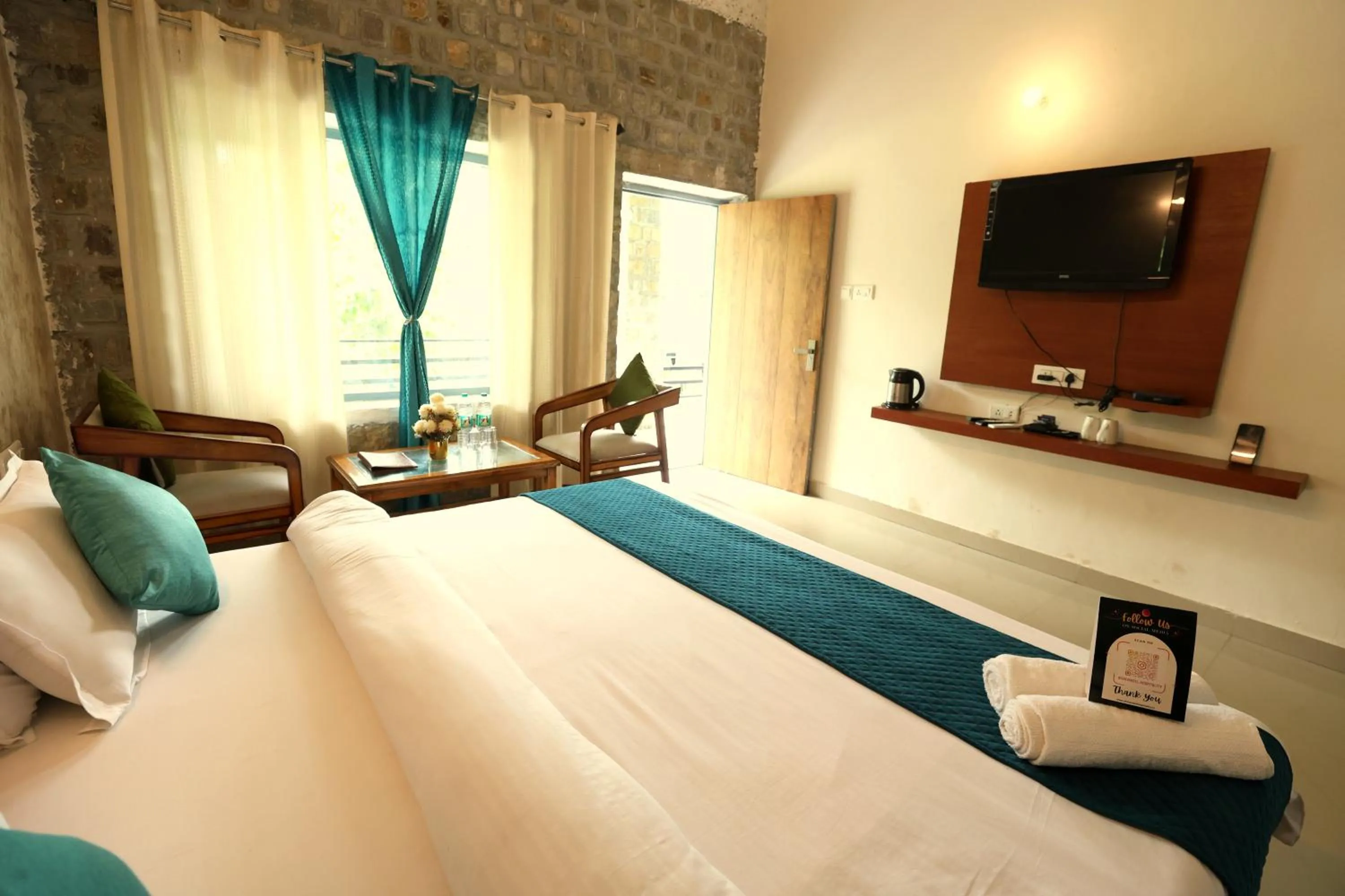 Bed in Aranya Resort & Suites By Shivaneel Hospitality
