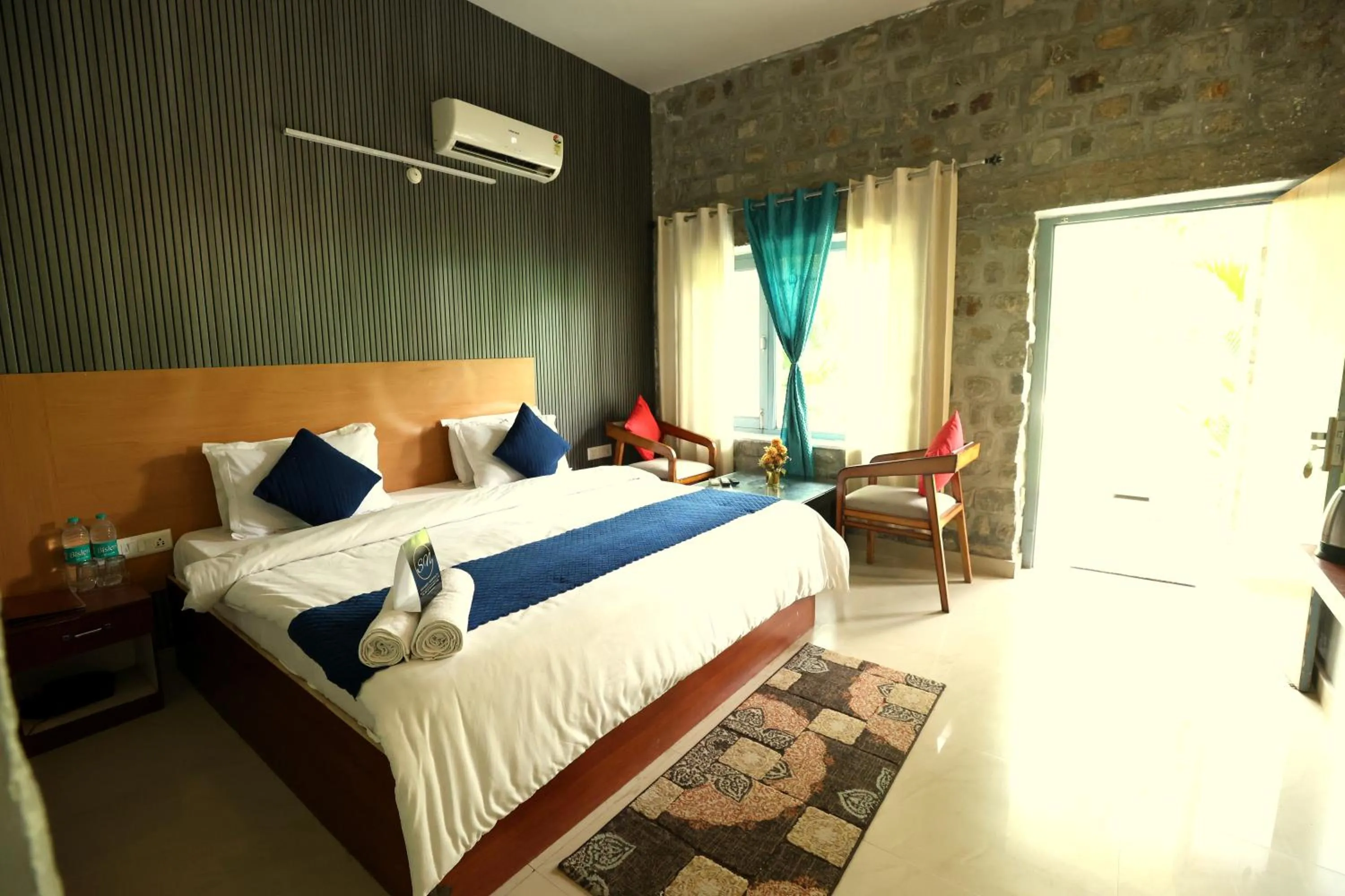 Photo of the whole room, Bed in Aranya Resort & Suites By Shivaneel Hospitality
