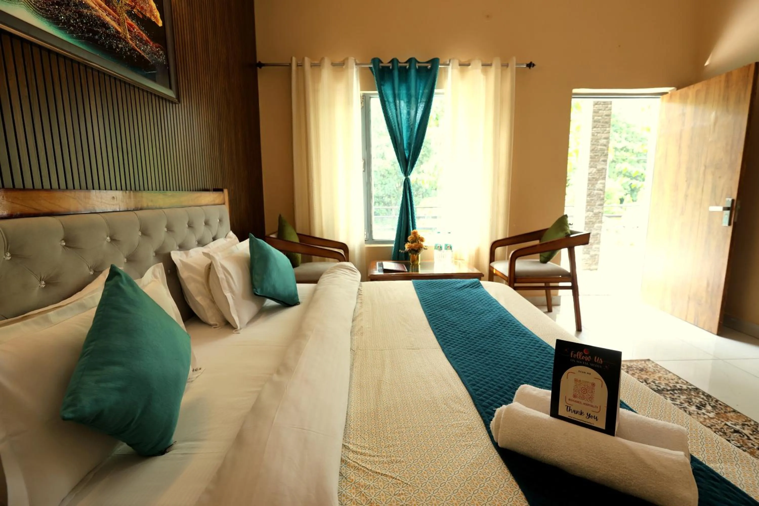 Photo of the whole room, Bed in Aranya Resort & Suites By Shivaneel Hospitality