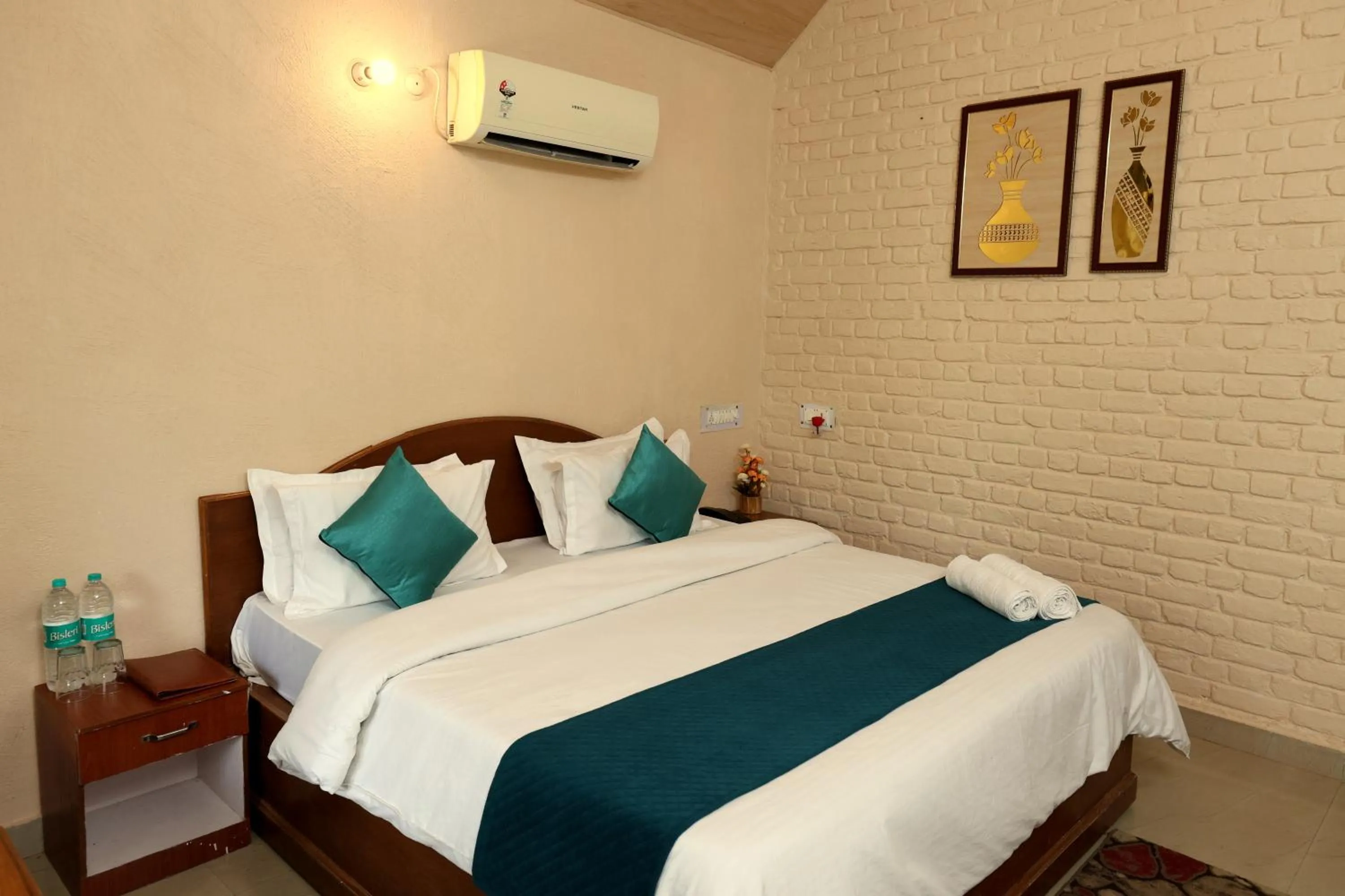 Photo of the whole room, Bed in Aranya Resort & Suites By Shivaneel Hospitality