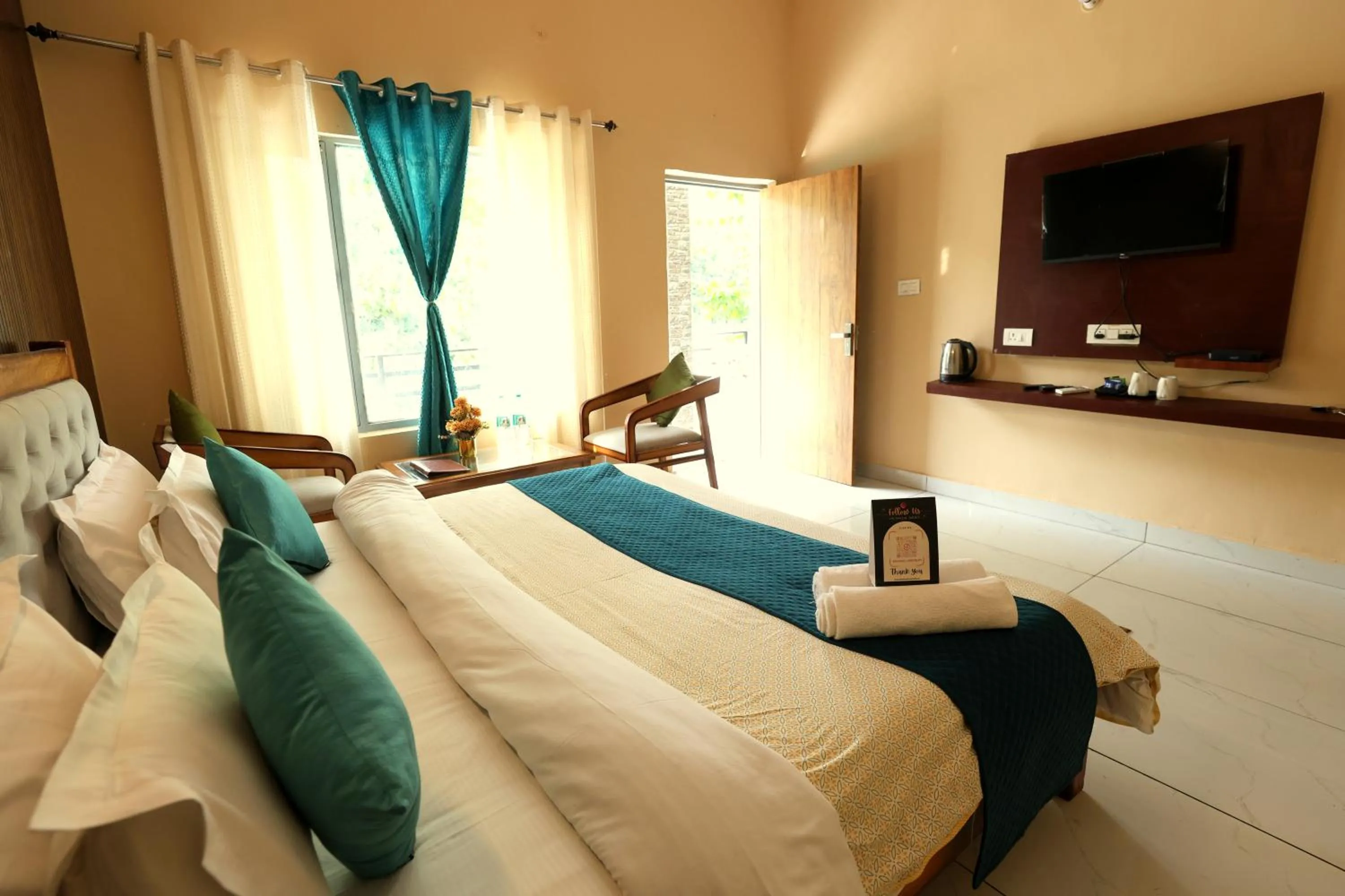 Photo of the whole room, Bed in Aranya Resort & Suites By Shivaneel Hospitality