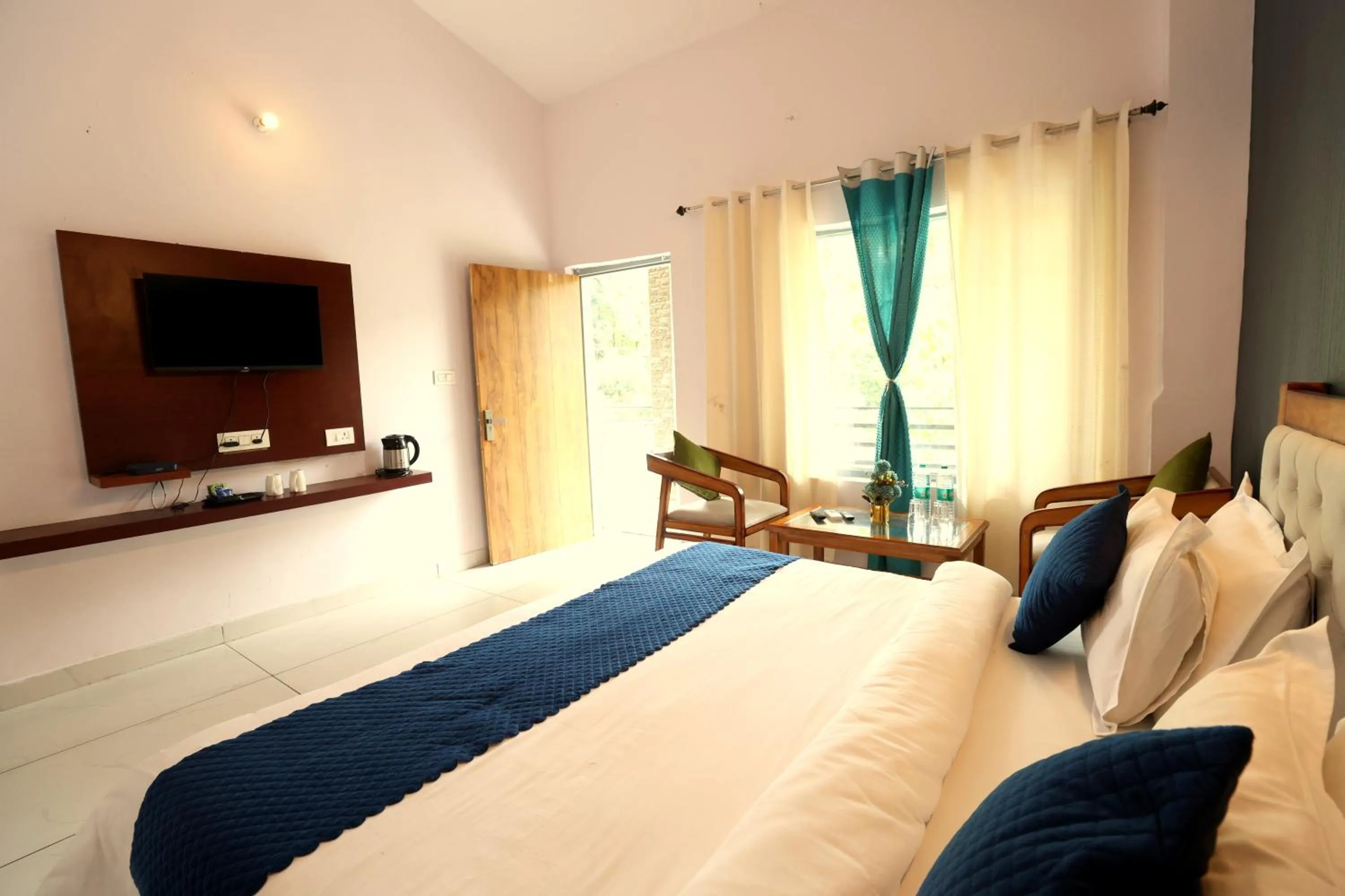 Photo of the whole room, Bed in Aranya Resort & Suites By Shivaneel Hospitality