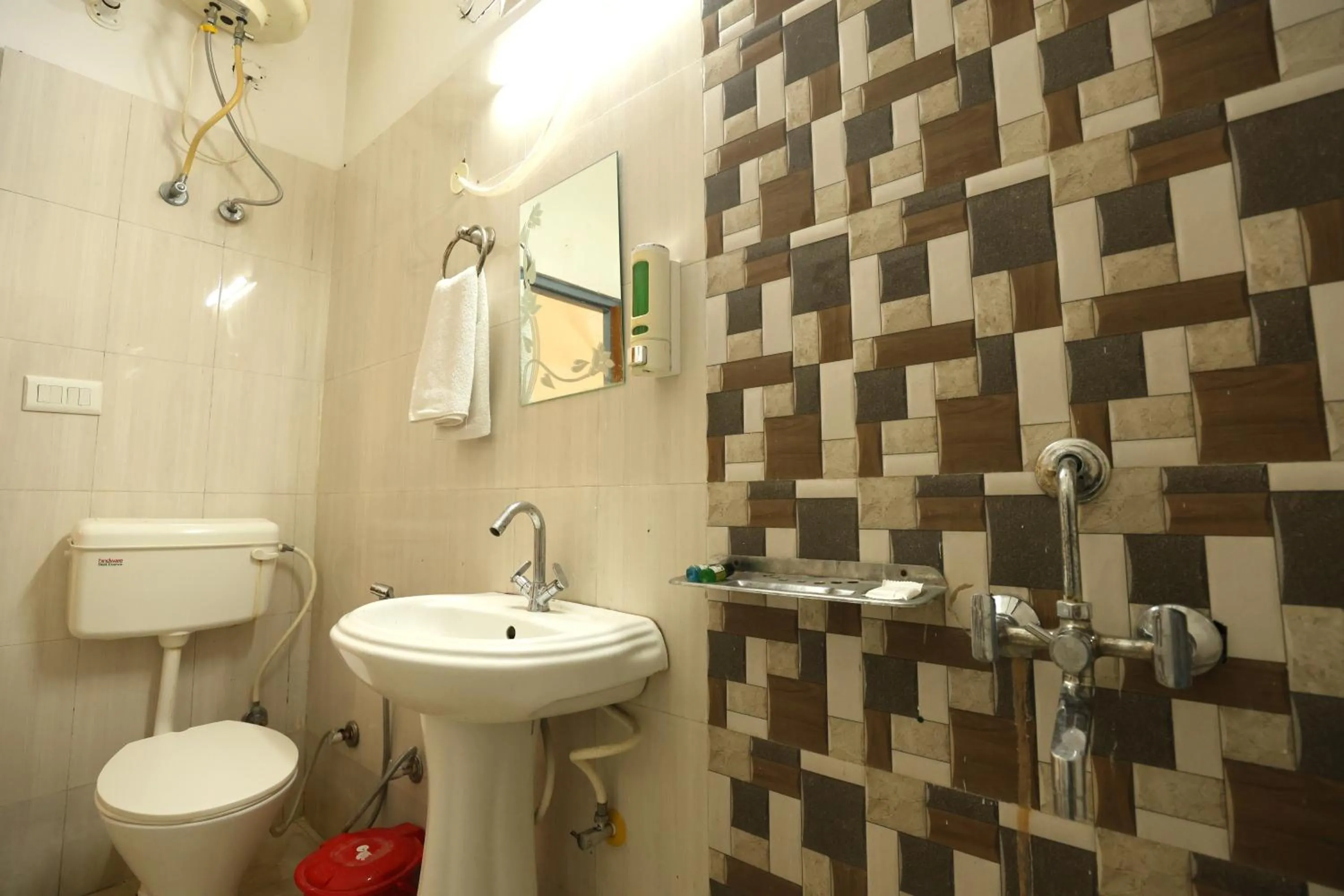 Bathroom in Aranya Resort & Suites By Shivaneel Hospitality