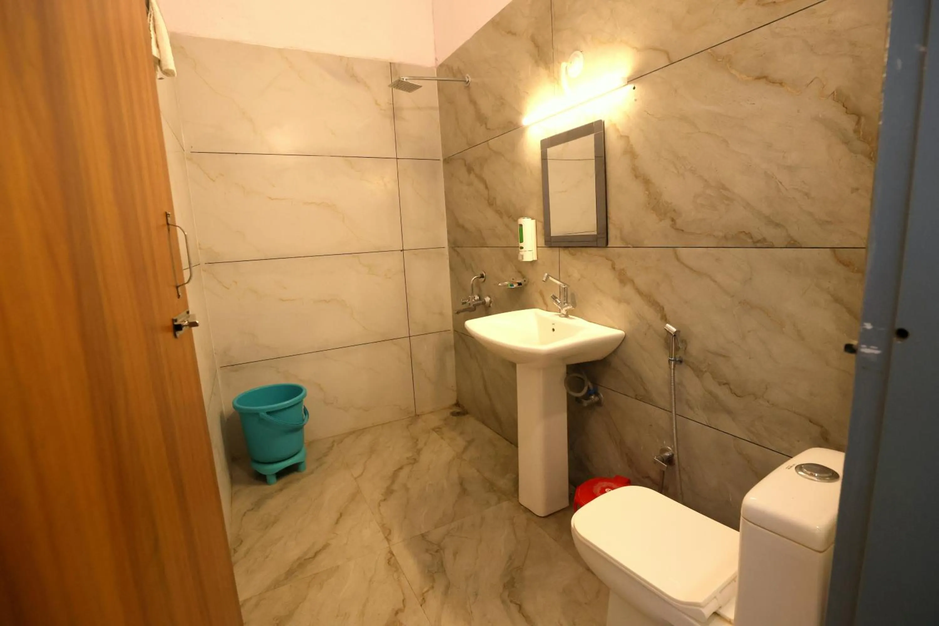 Bathroom in Aranya Resort & Suites By Shivaneel Hospitality