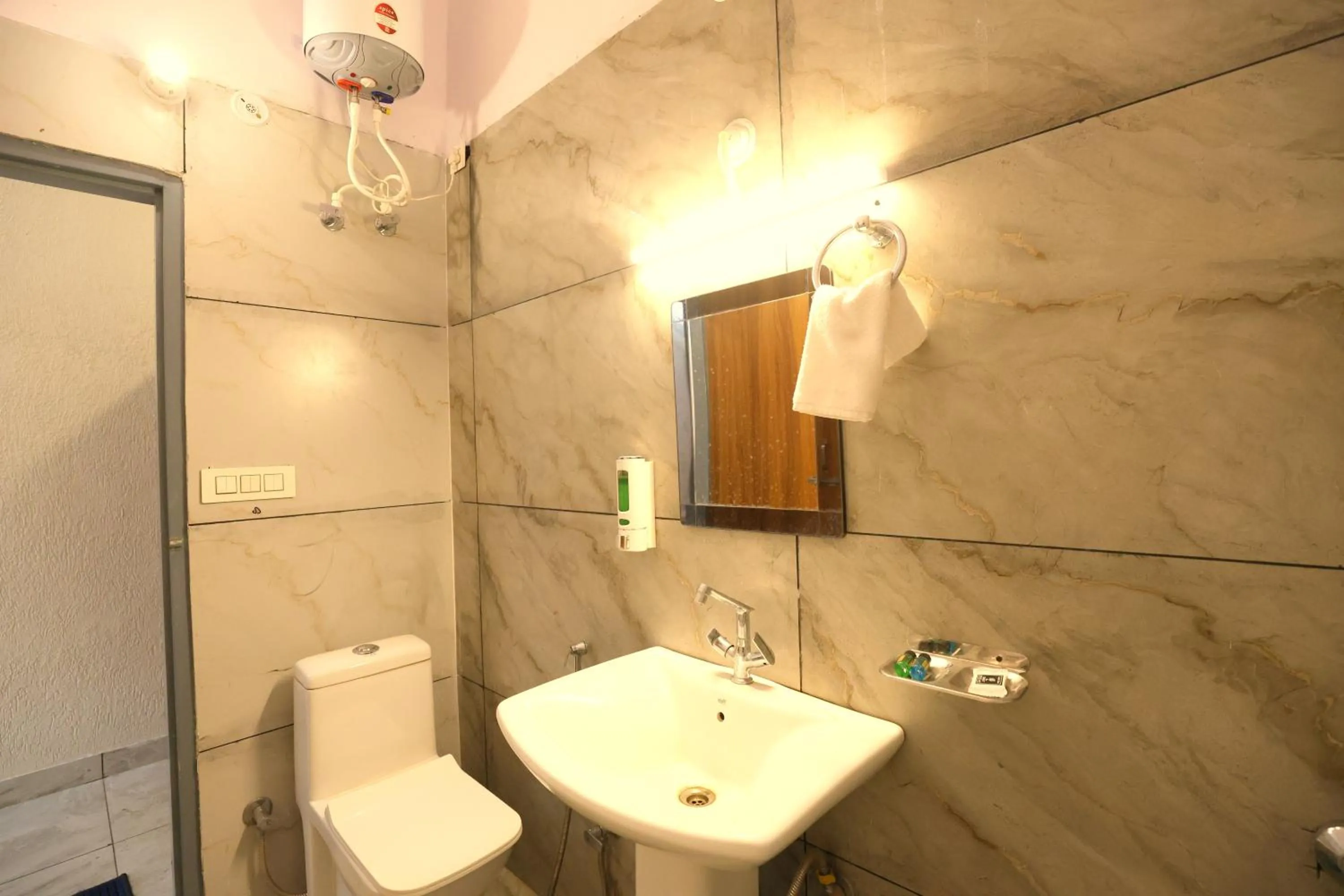 Toilet in Aranya Resort & Suites By Shivaneel Hospitality