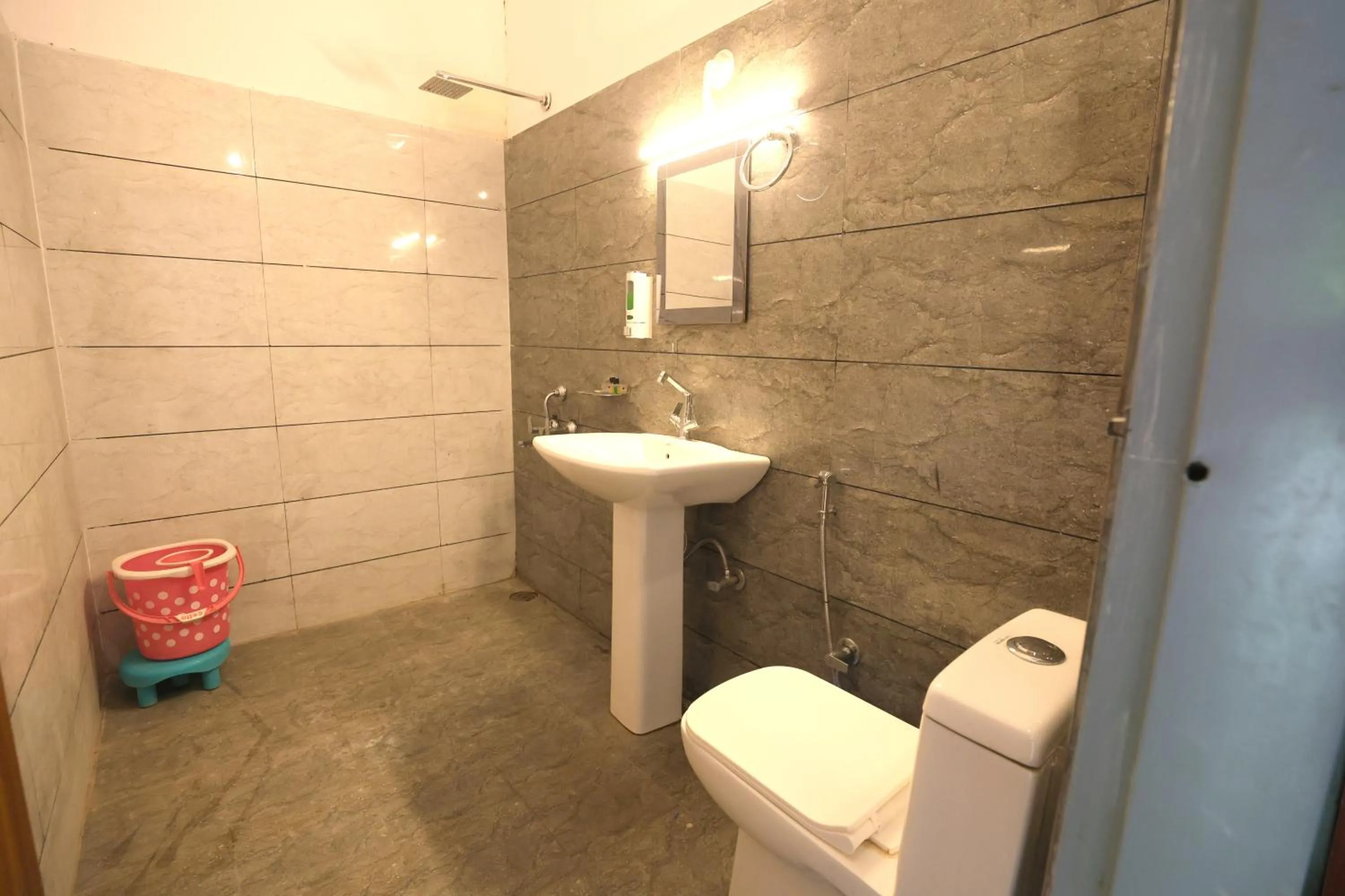 Bathroom in Aranya Resort & Suites By Shivaneel Hospitality
