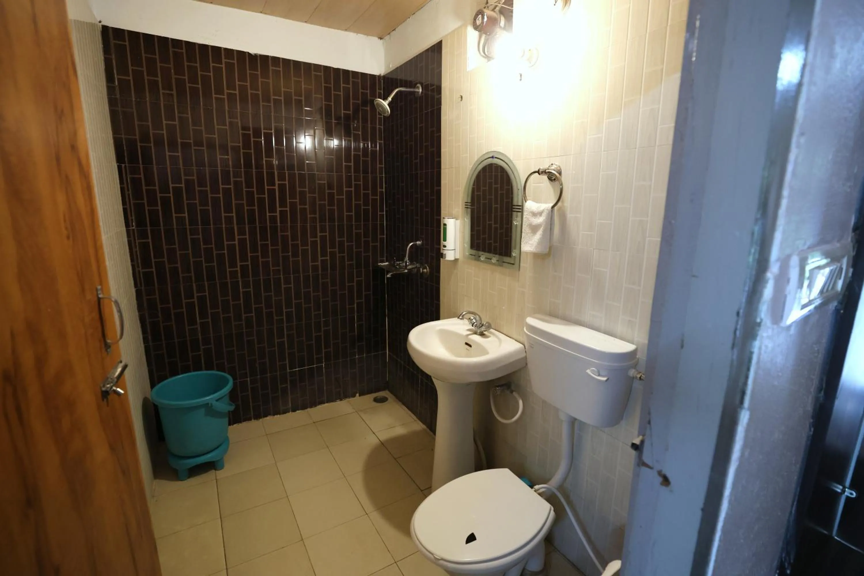 Toilet in Aranya Resort & Suites By Shivaneel Hospitality