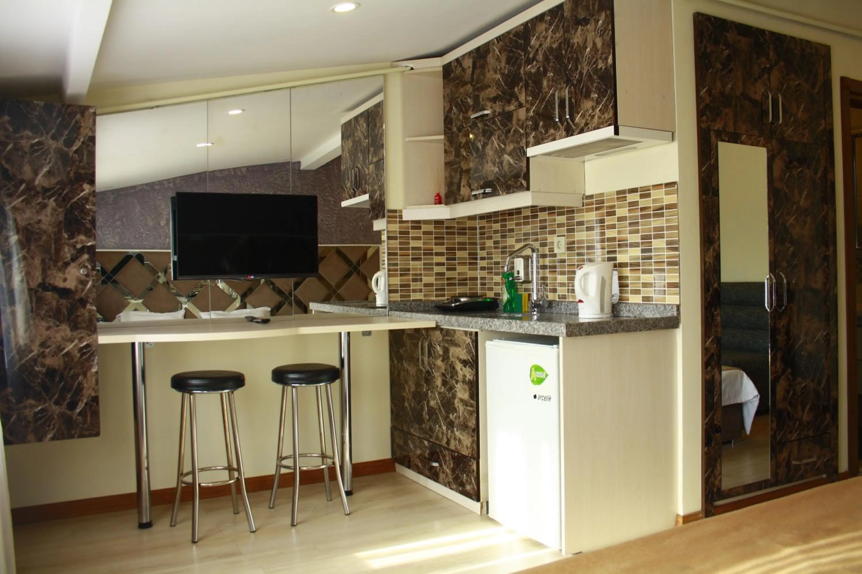Kitchen or kitchenette in Terra Suites