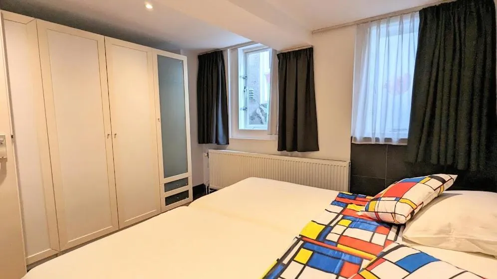 Bed in The Amsterdam Hotel Apartment in the Center