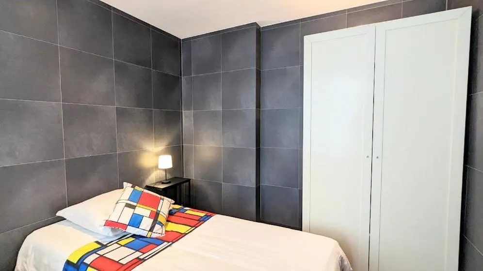 Bed in The Amsterdam Hotel Apartment in the Center