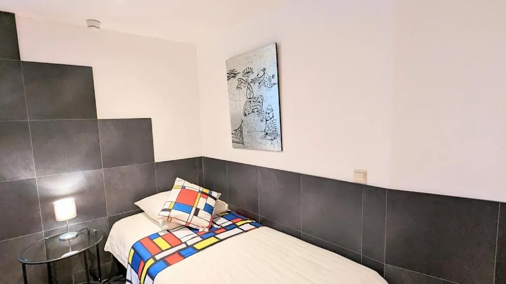 Bed in The Amsterdam Hotel Apartment in the Center