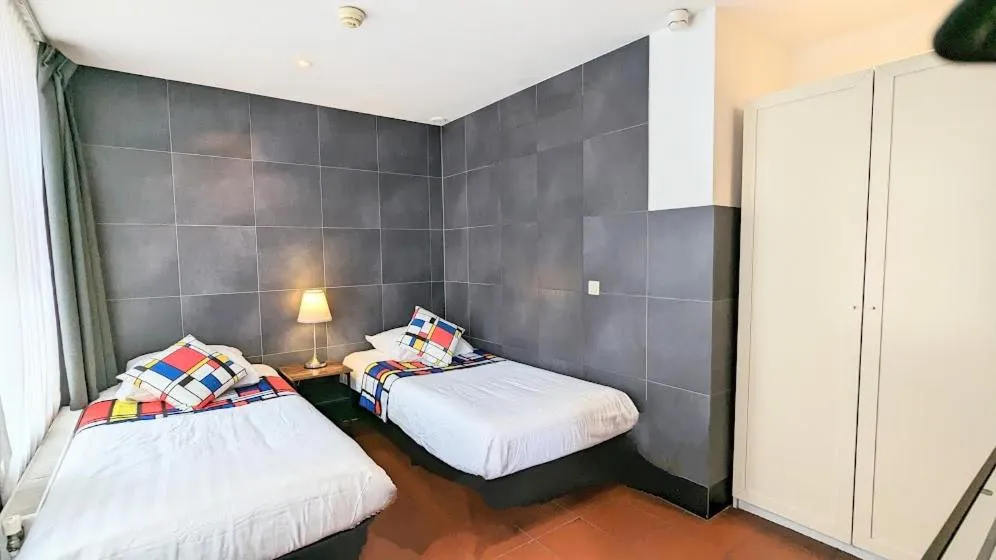 Bed in The Amsterdam Hotel Apartment in the Center