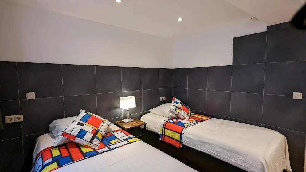 Bed in The Amsterdam Hotel Apartment in the Center