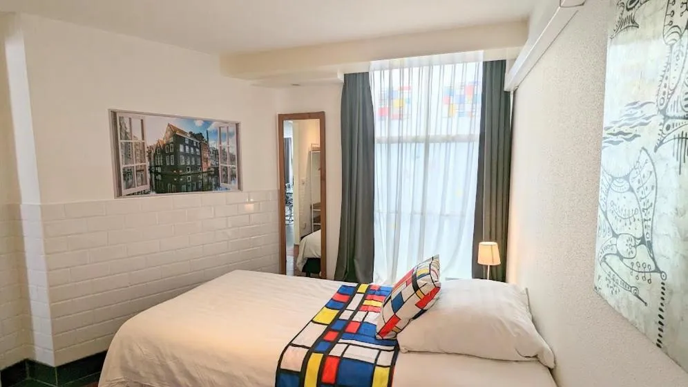 Bed in The Amsterdam Hotel Apartment in the Center