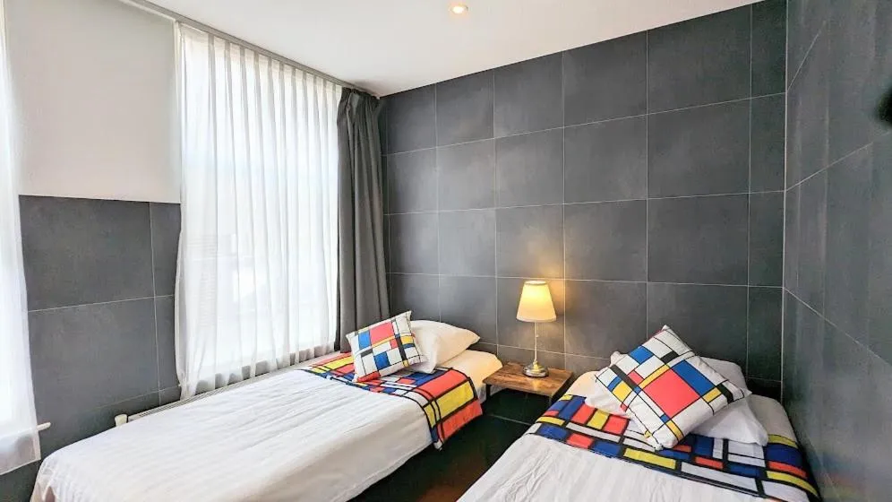 Bed in The Amsterdam Hotel Apartment in the Center