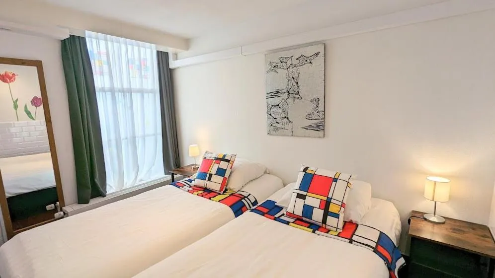 Bed in The Amsterdam Hotel Apartment in the Center