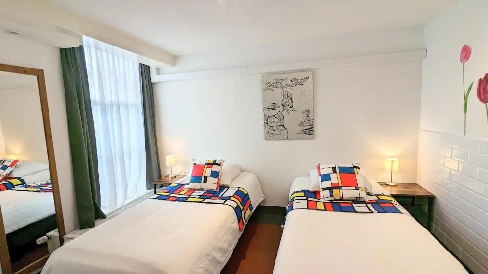 Bed in The Amsterdam Hotel Apartment in the Center