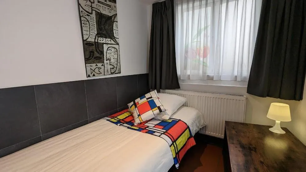 Bed in The Amsterdam Hotel Apartment in the Center