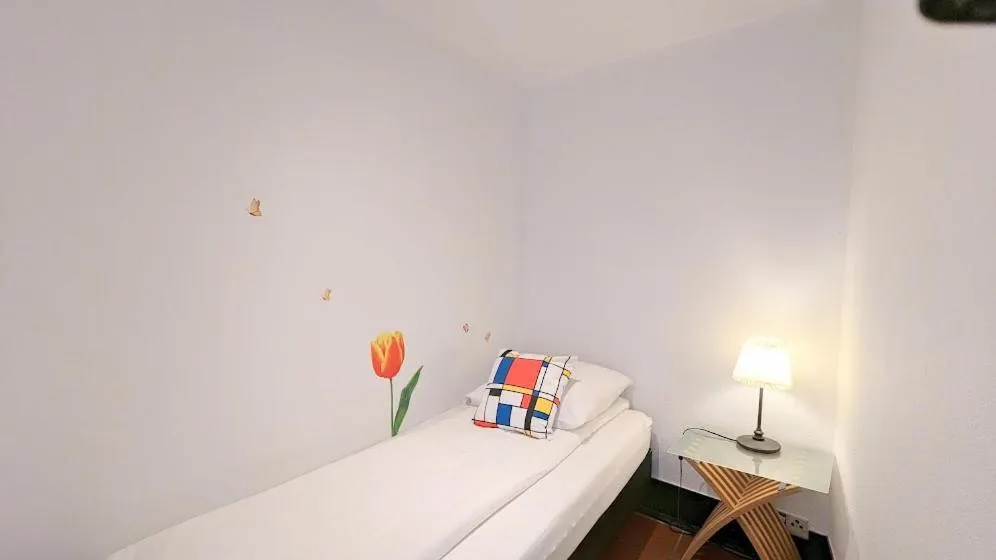 Bed in The Amsterdam Hotel Apartment in the Center