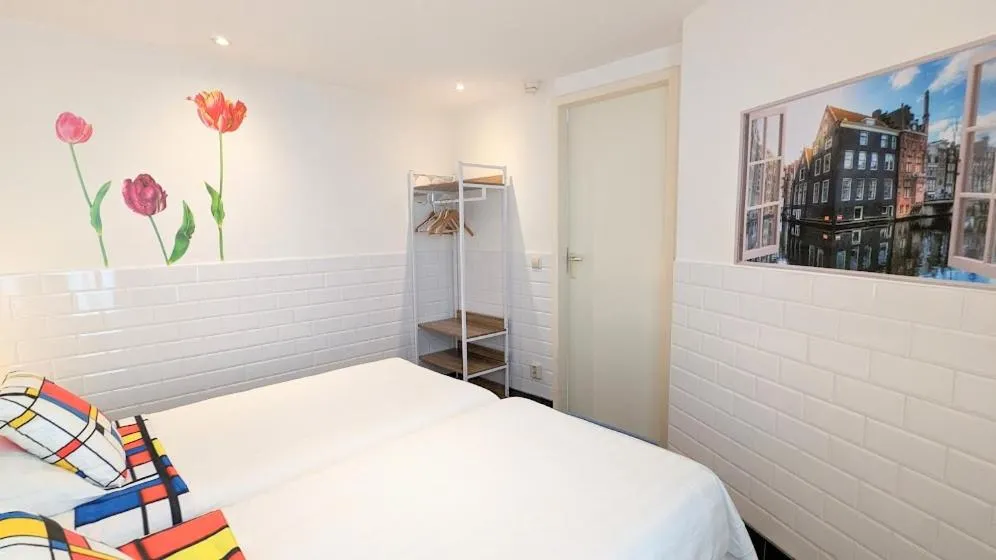 Bed in The Amsterdam Hotel Apartment in the Center