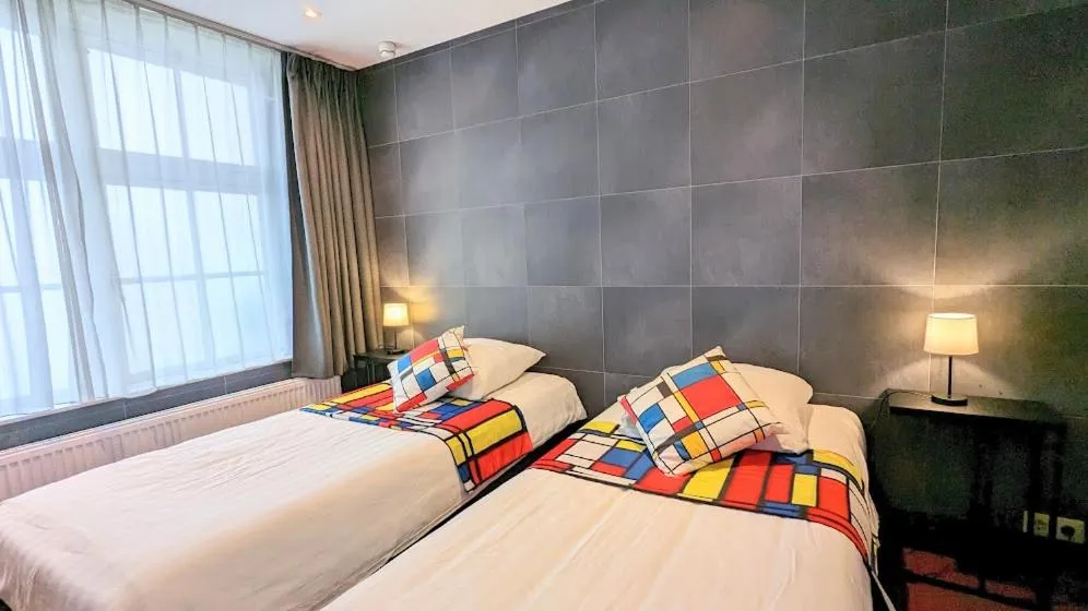 Bed in The Amsterdam Hotel Apartment in the Center